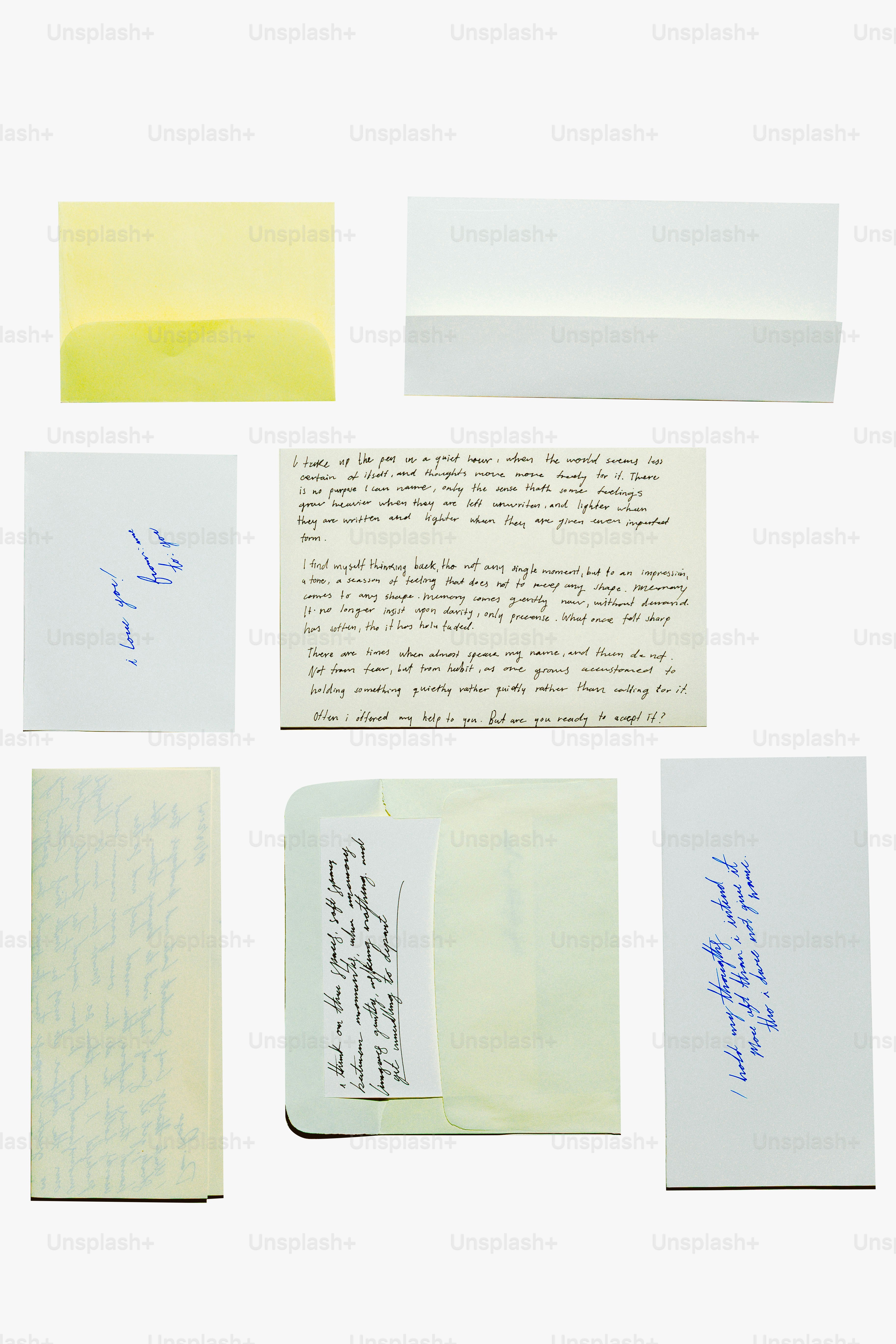 Collection of letters and envelopes arranged on white background
