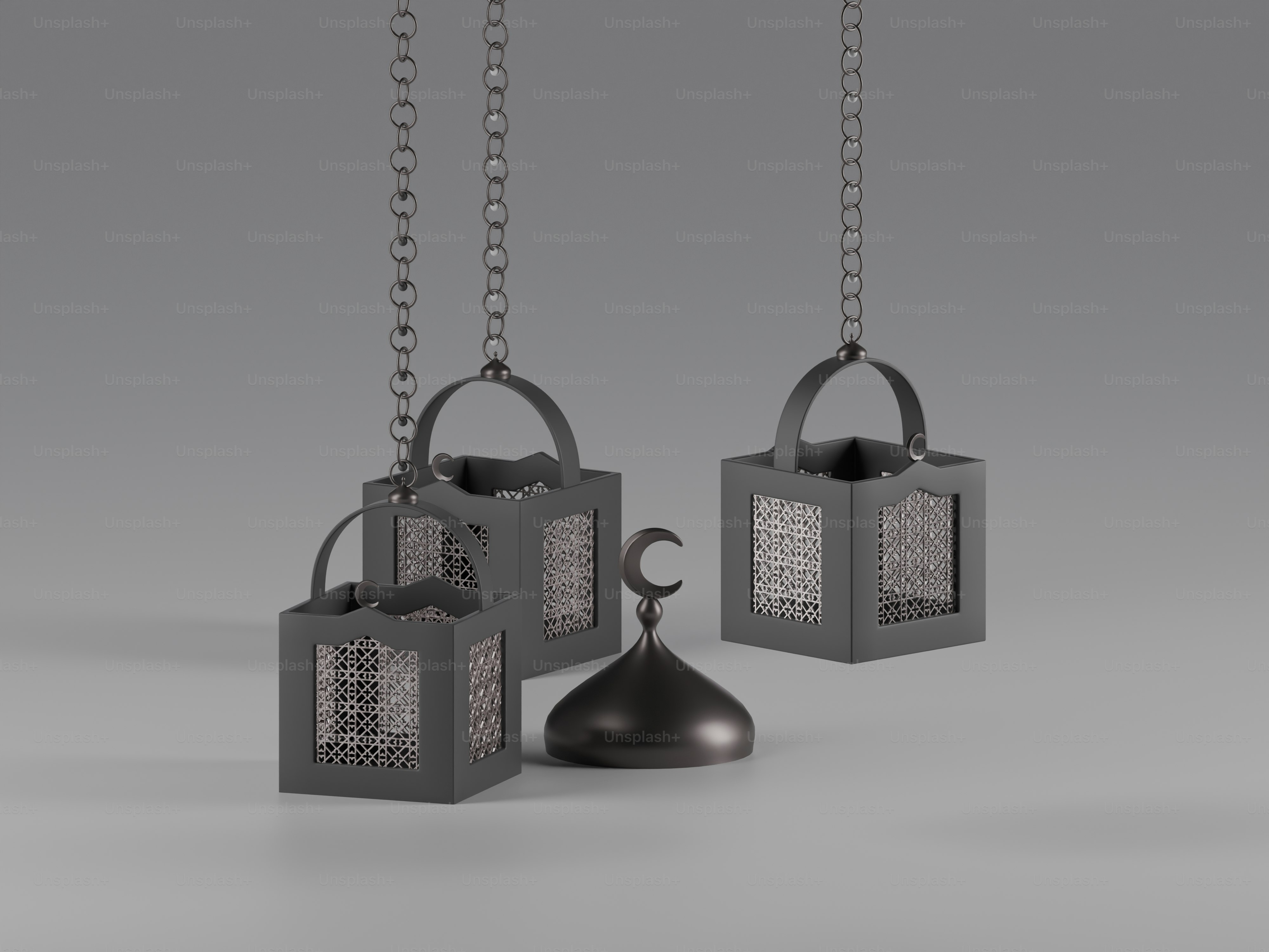 Three decorative lanterns and a crescent moon ornament