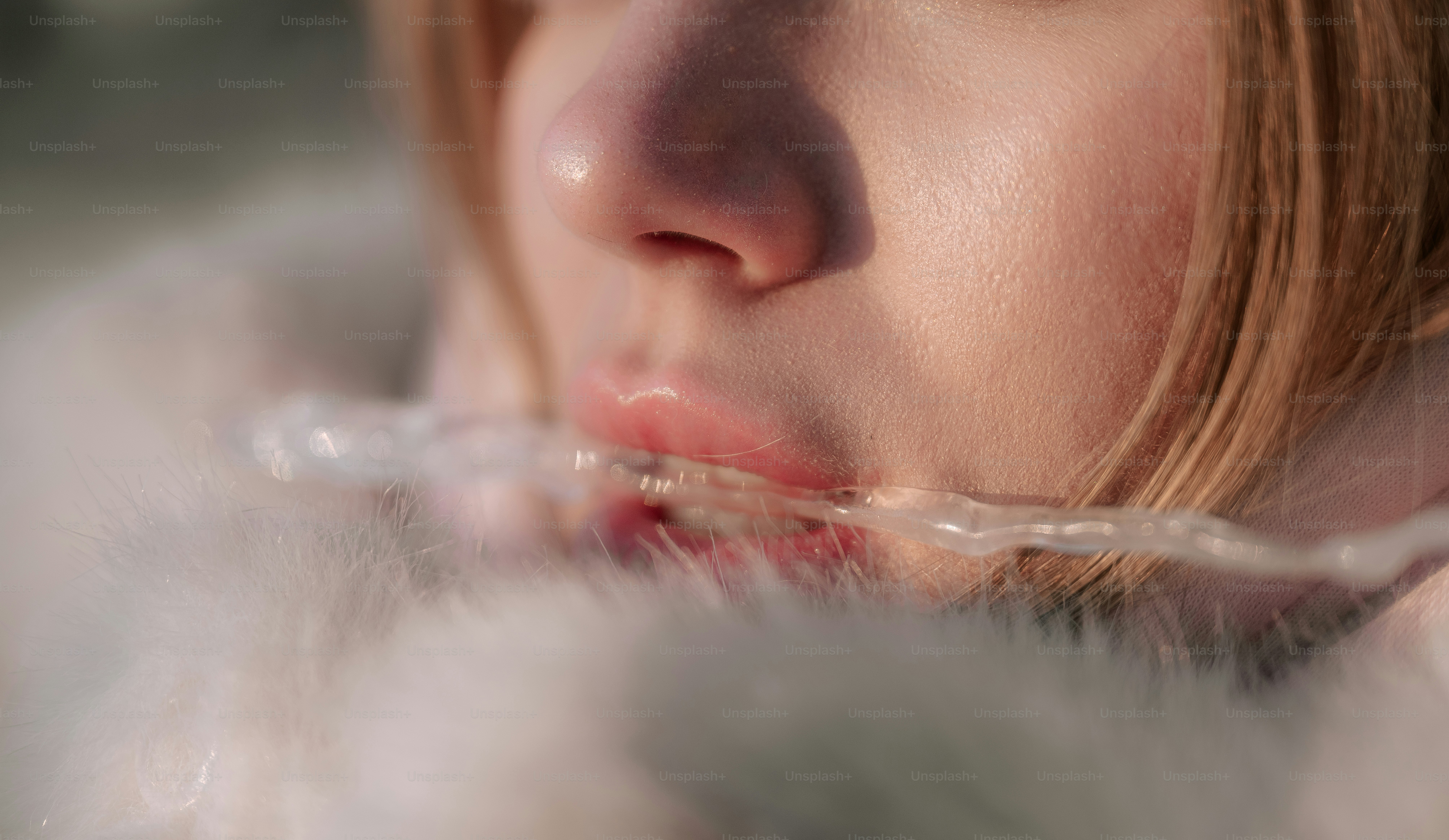 Woman's face with water running from mouth