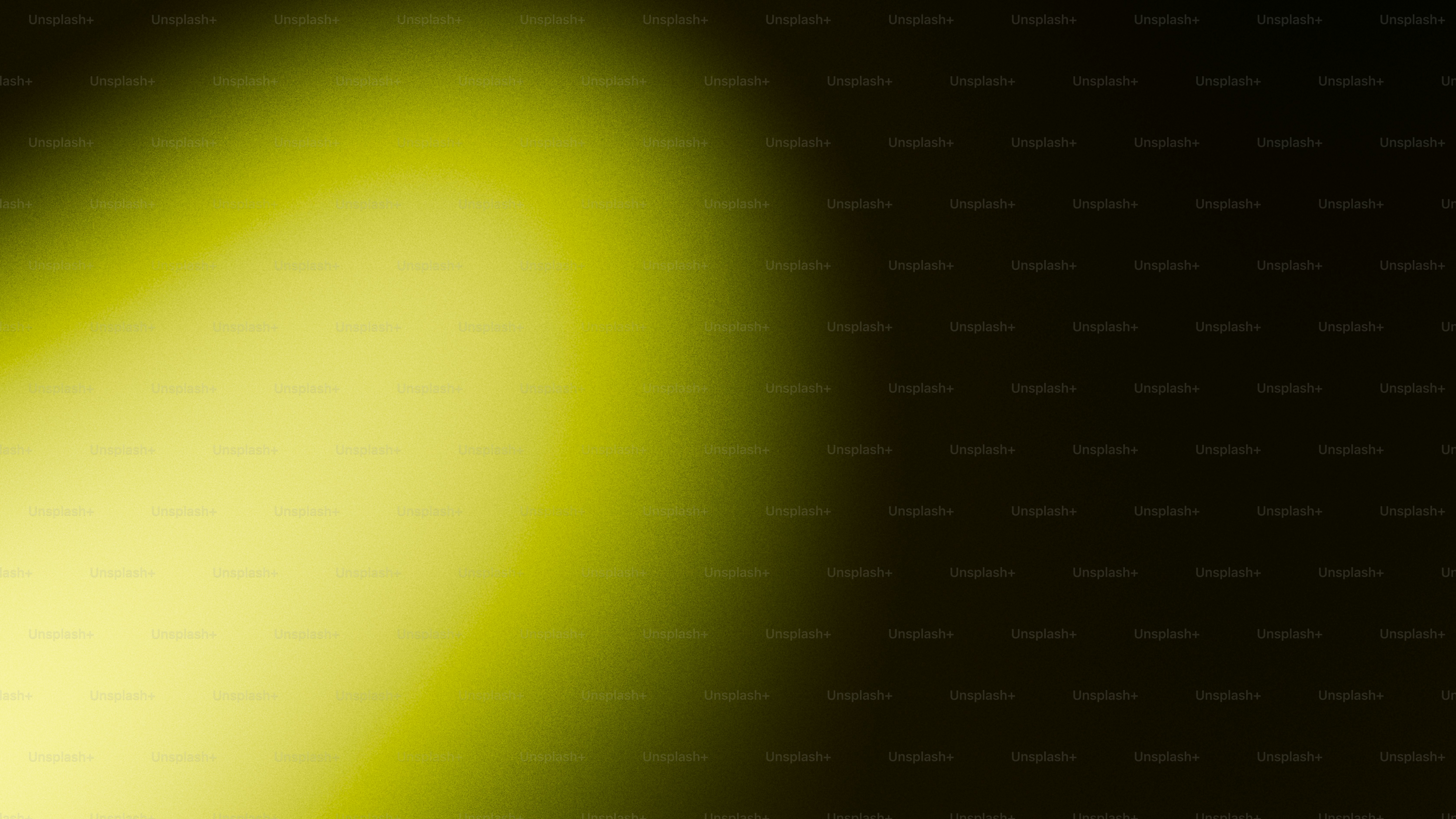 A soft yellow light fades into darkness