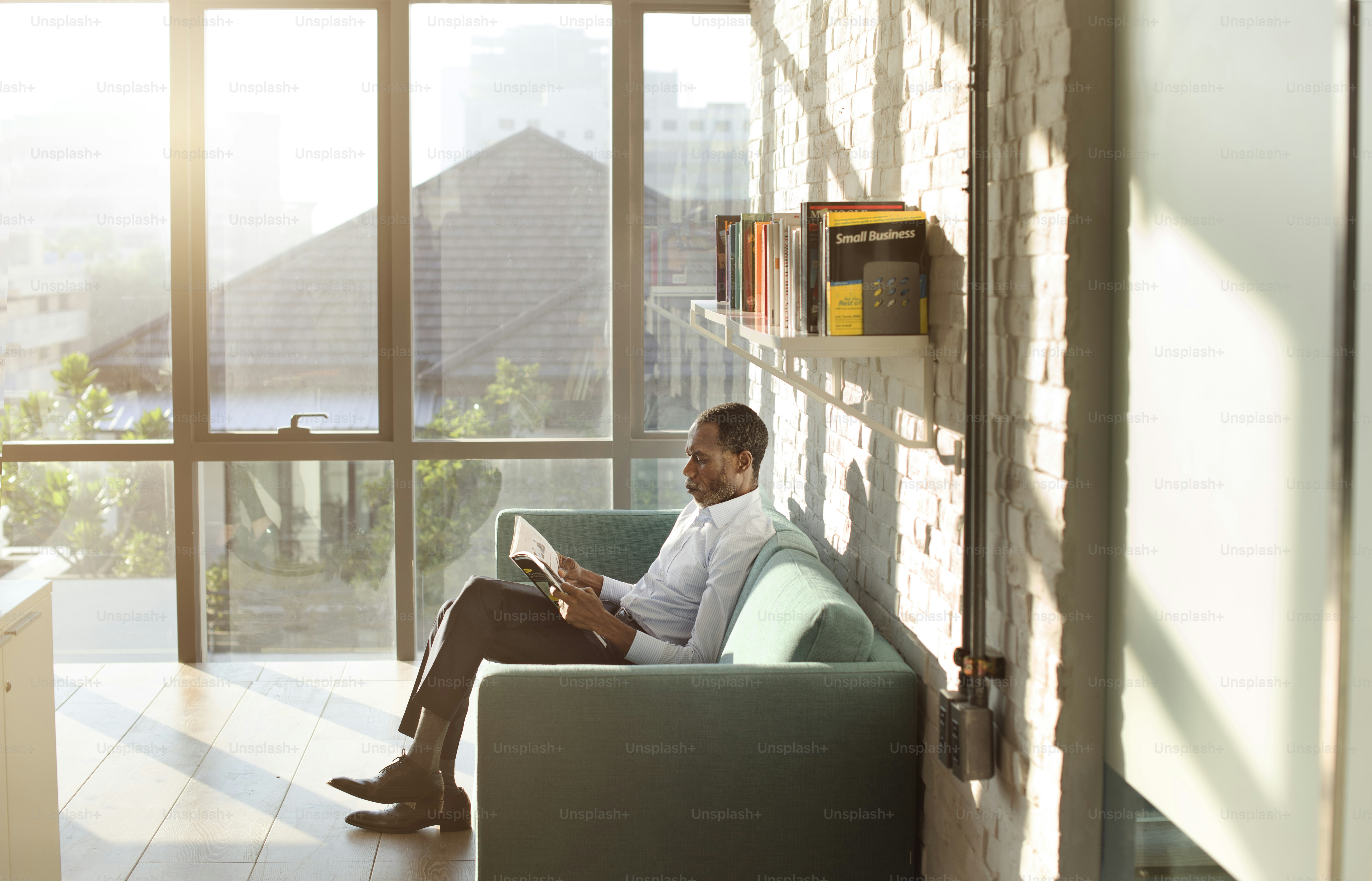 Businessman Reading Magazine Relaxation Concept