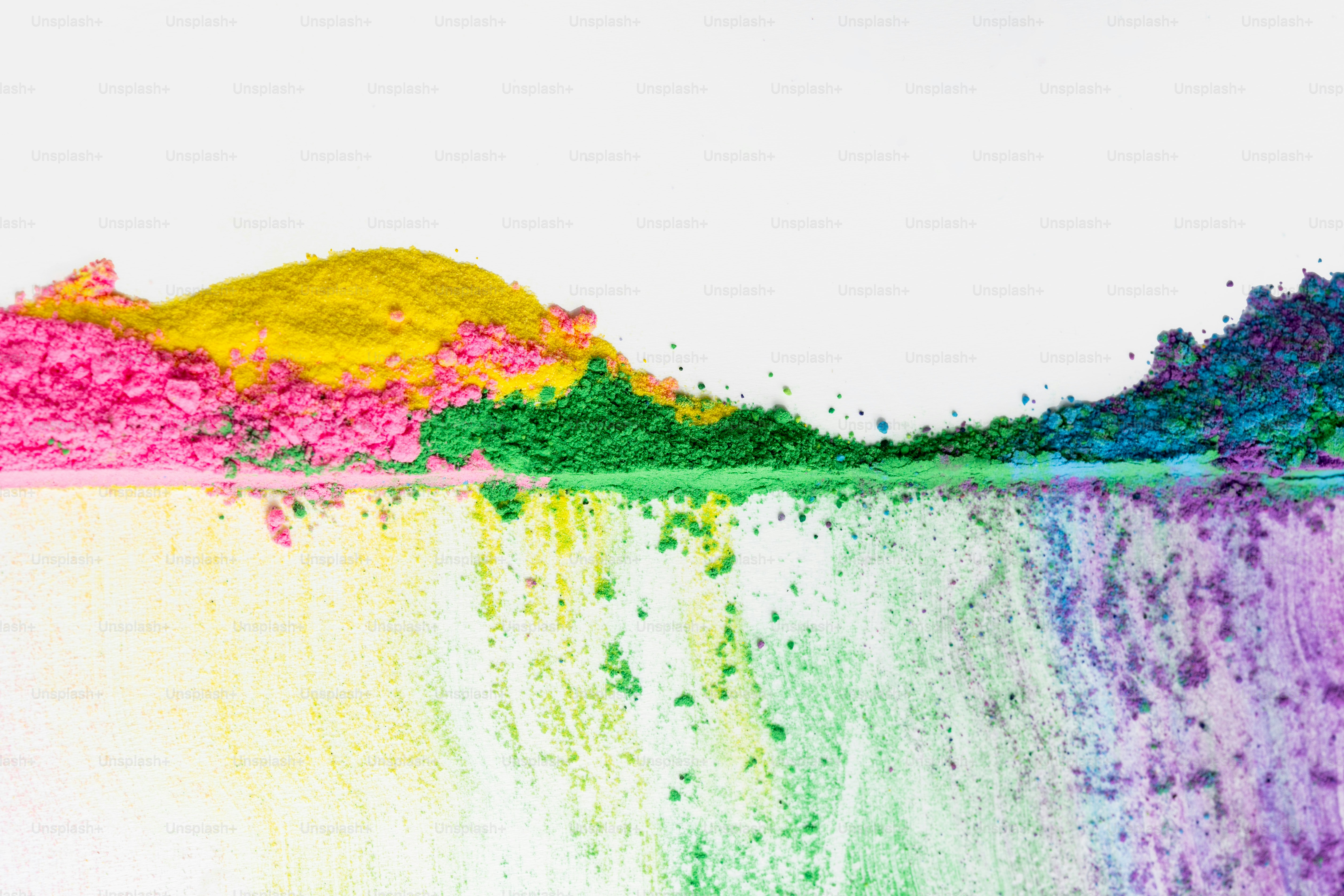Colorful powders arranged in abstract lines on white background