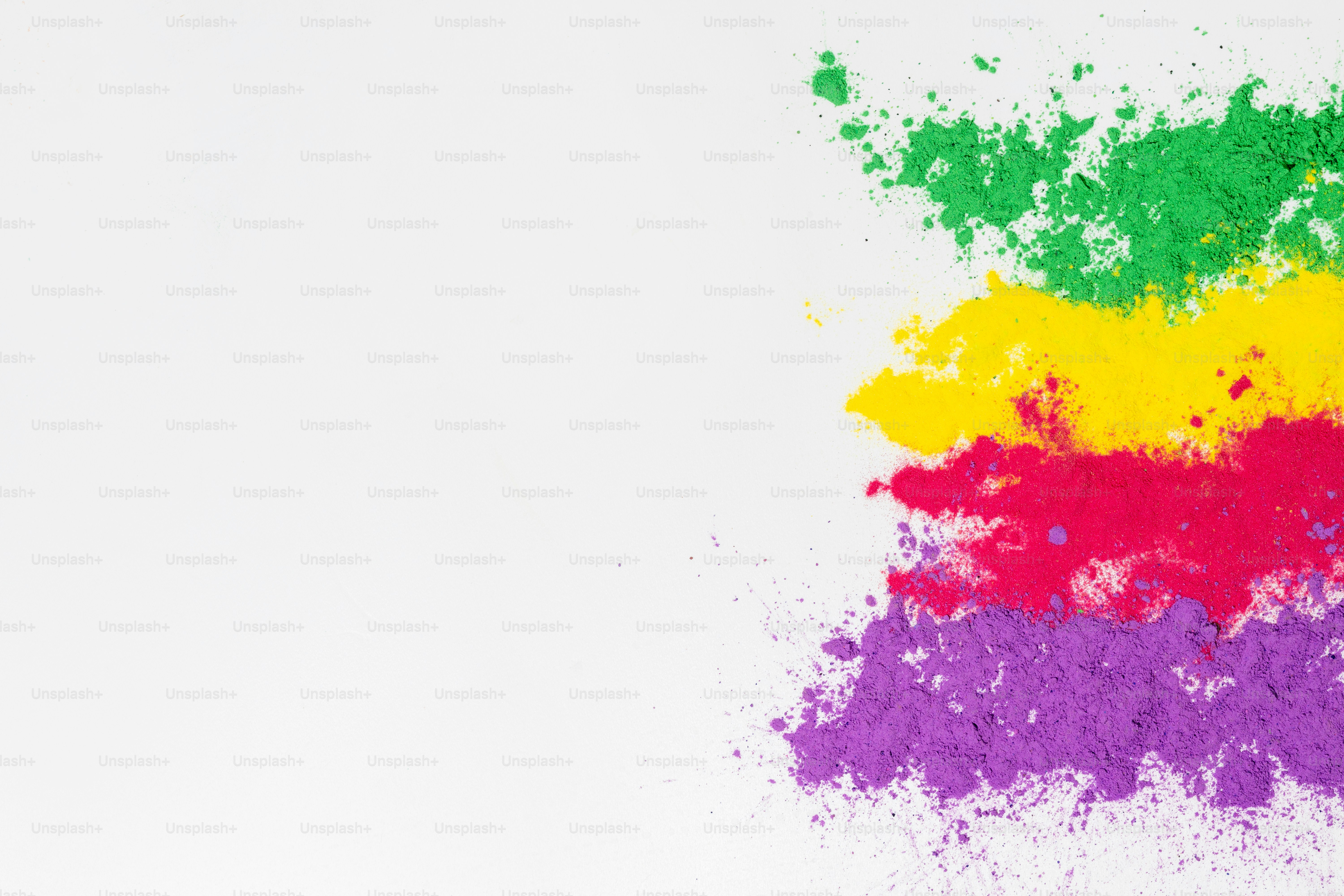 Colorful powder scattered on a white background