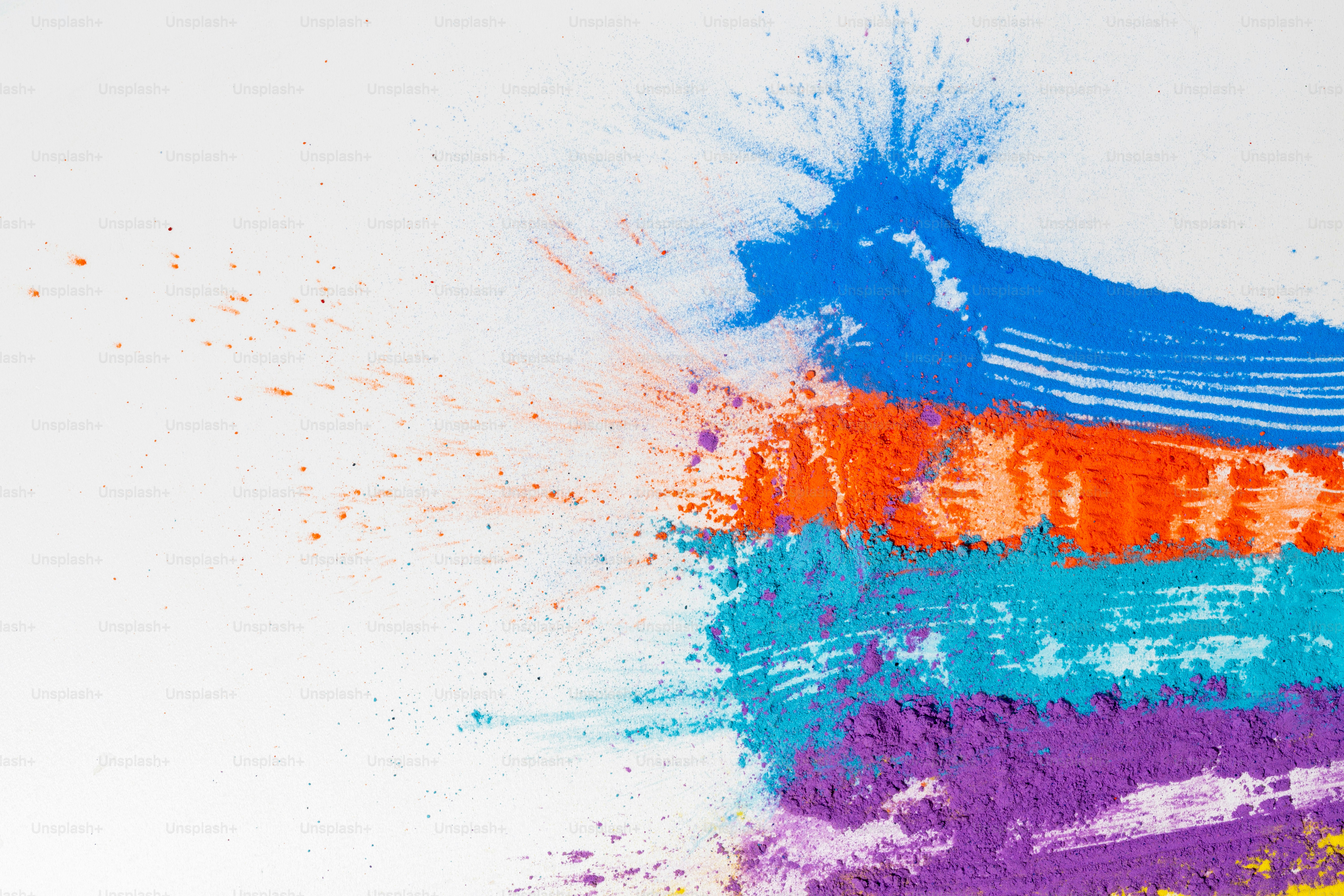 Colorful powder paint streaks on white background
