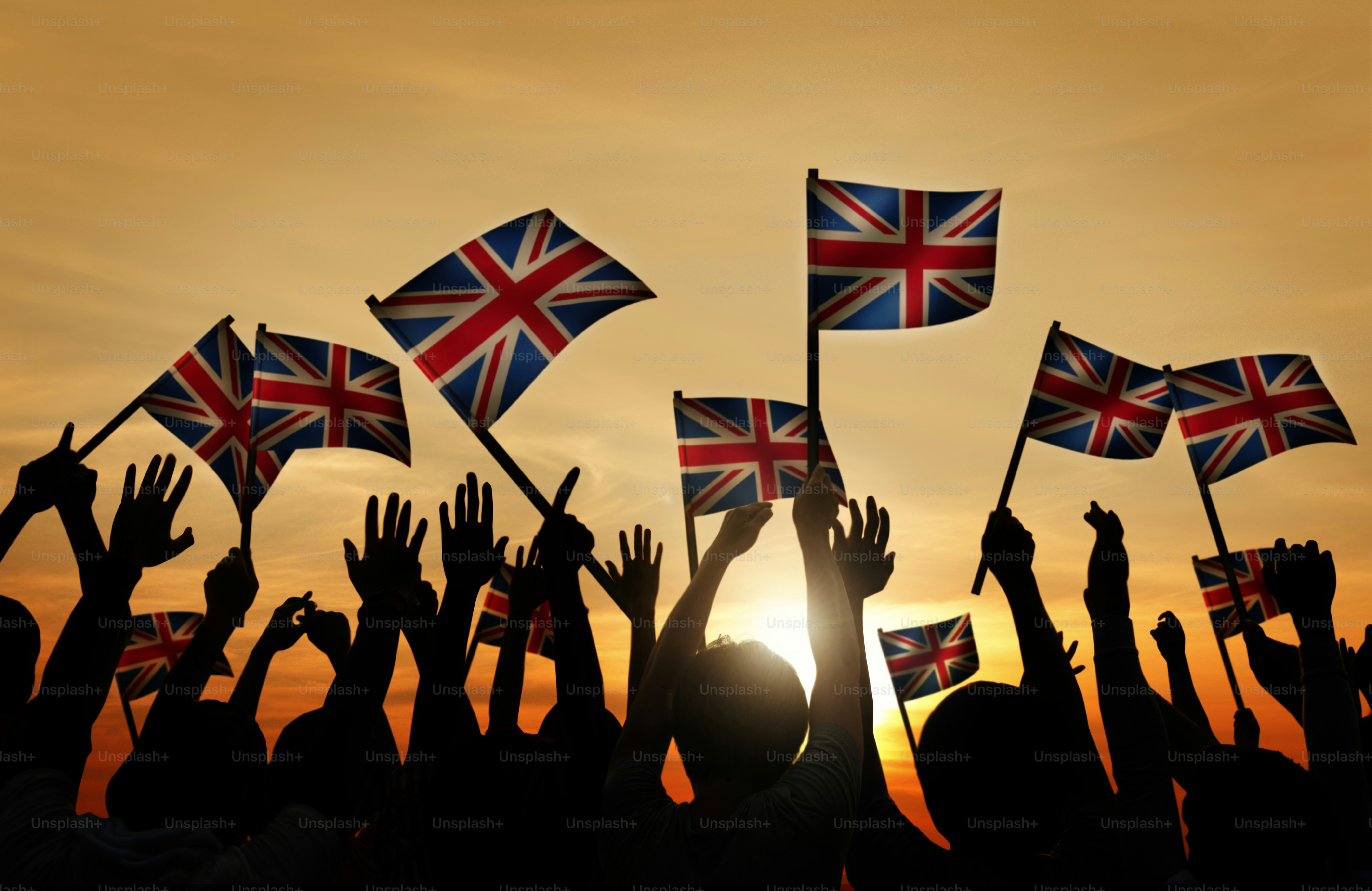 Crowd Holding The Union Jack Flag