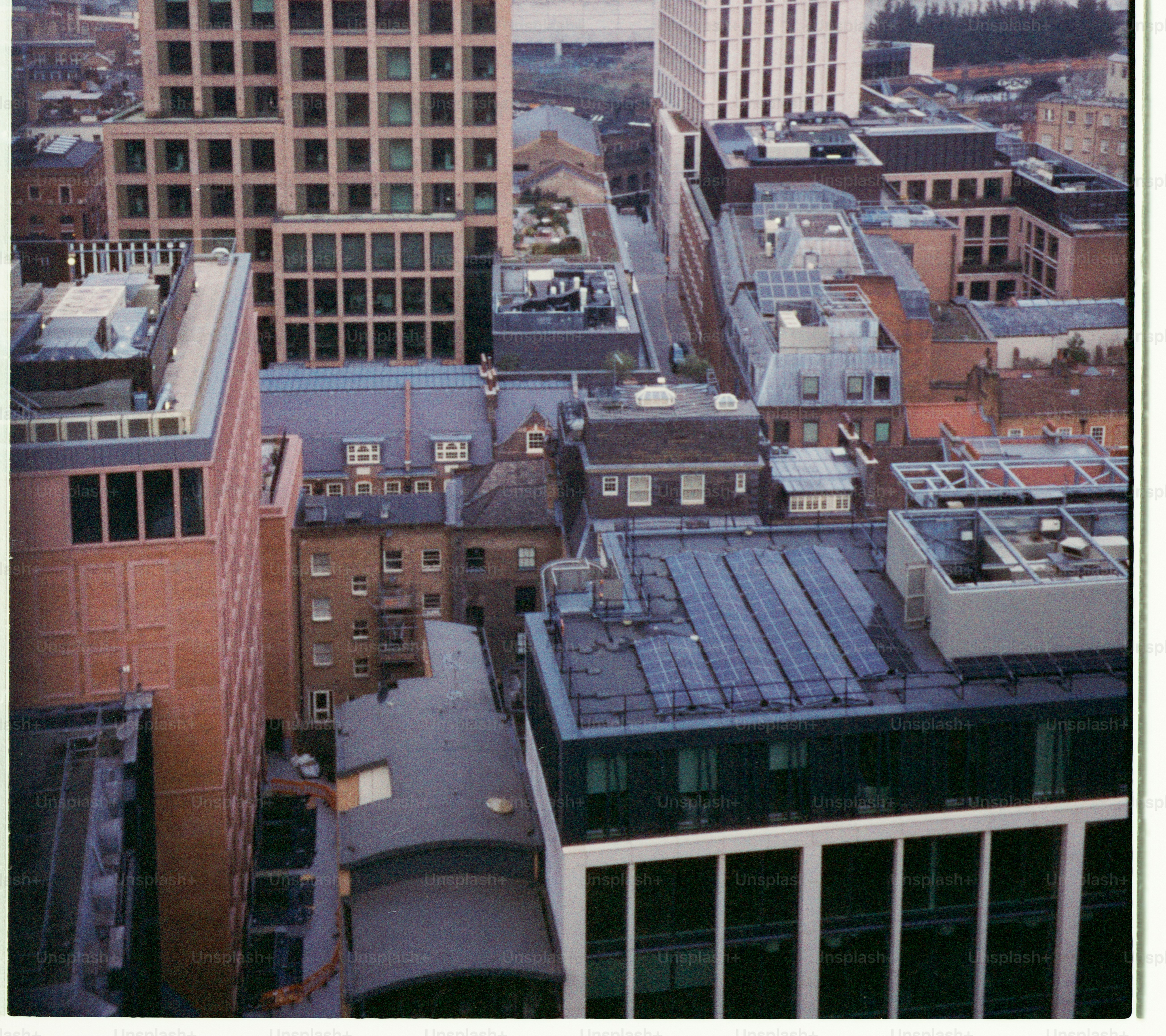 Aerial view of a dense urban cityscape with modern buildings.