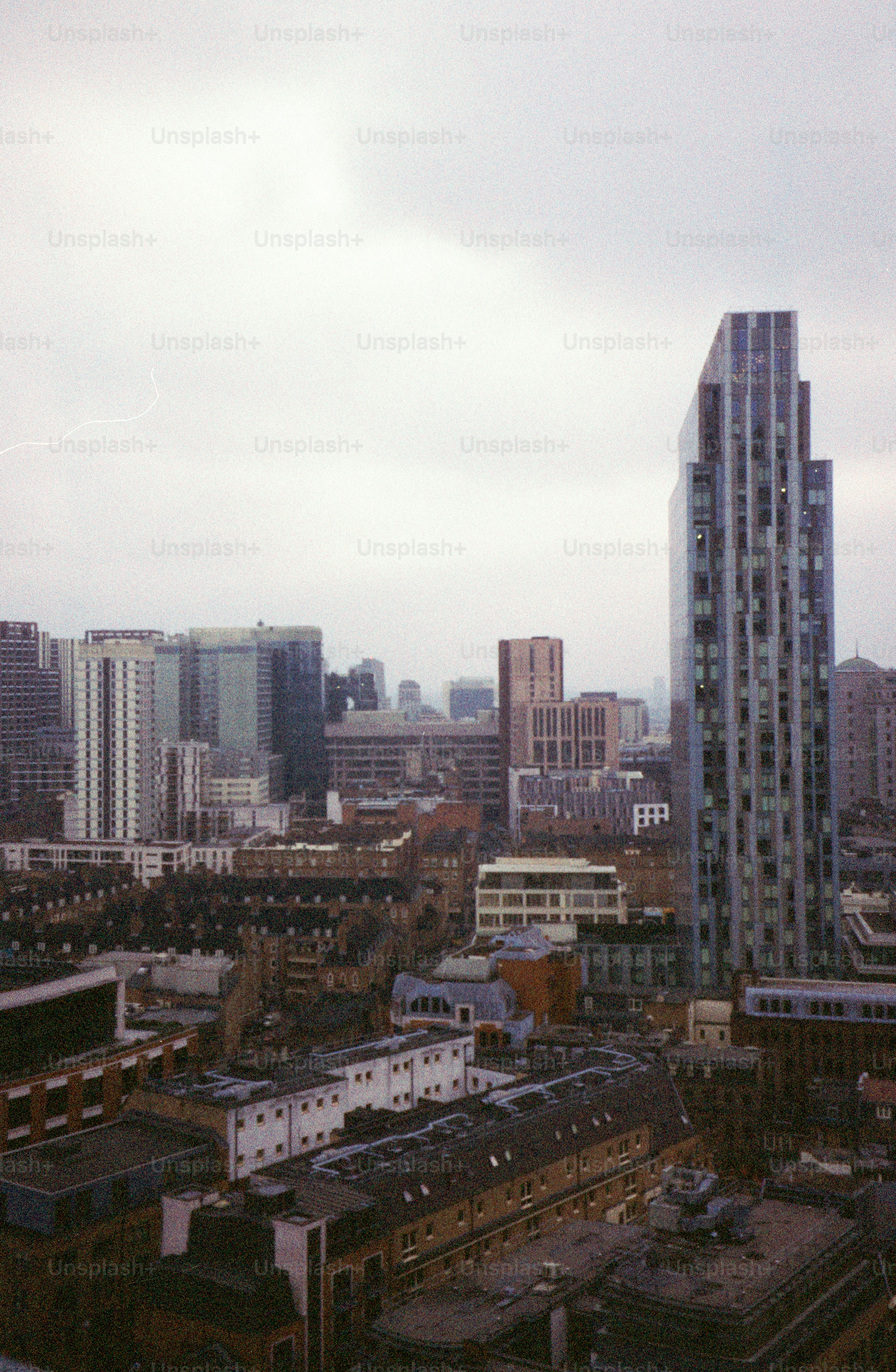 Modern skyscrapers towering over city buildings