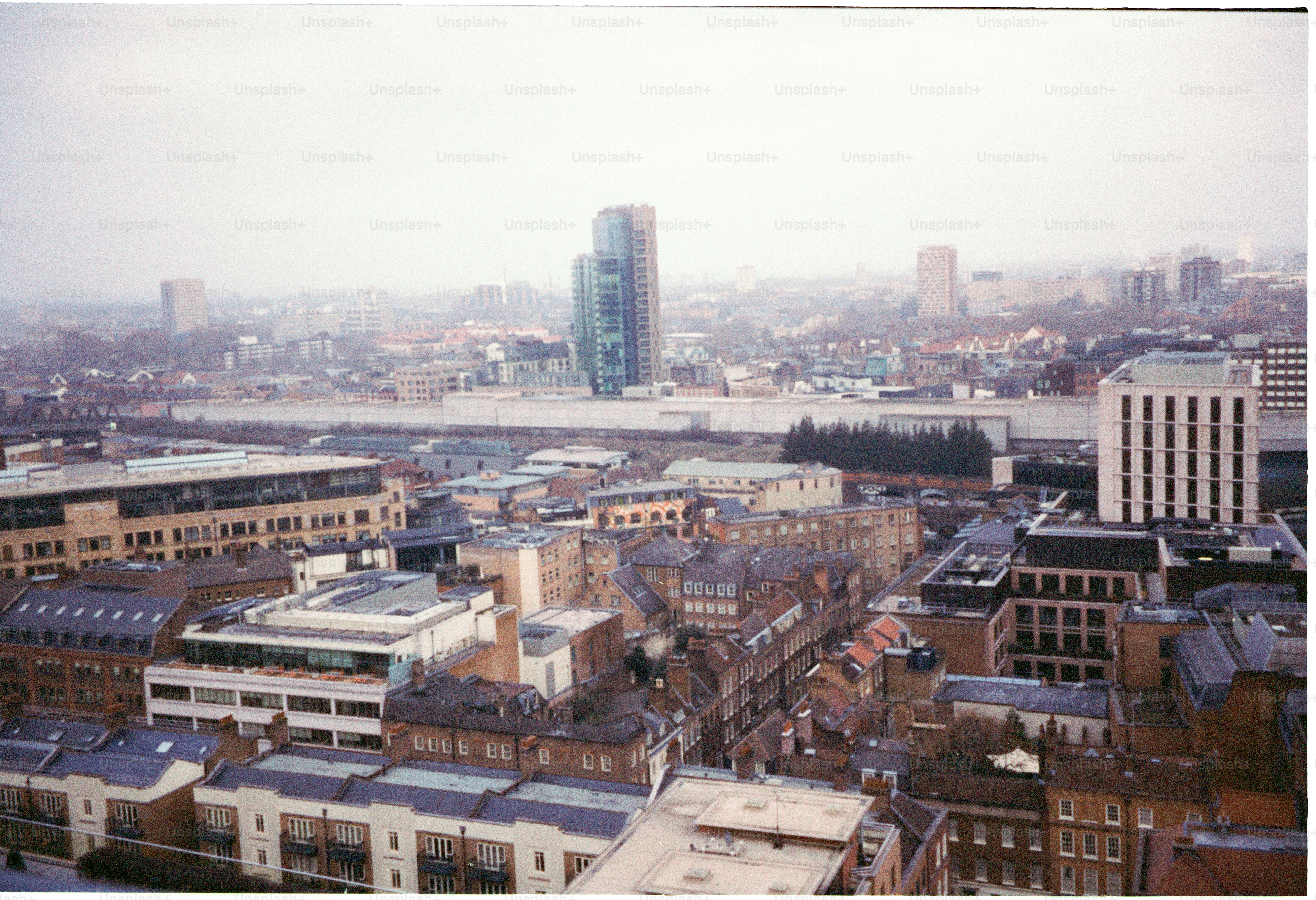 Urban cityscape with tall buildings and cloudy sky