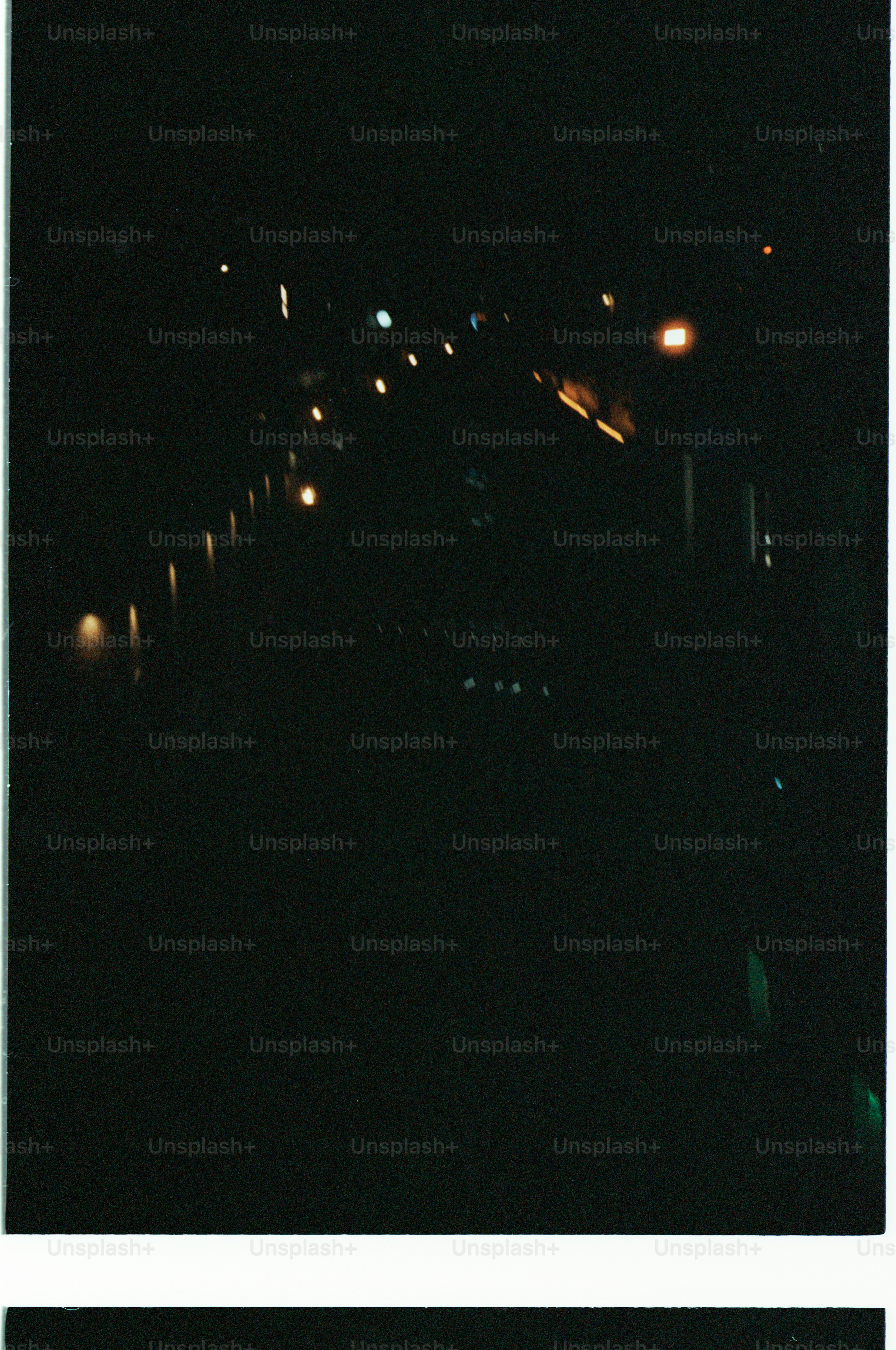 Blurred lights on a dark street at night