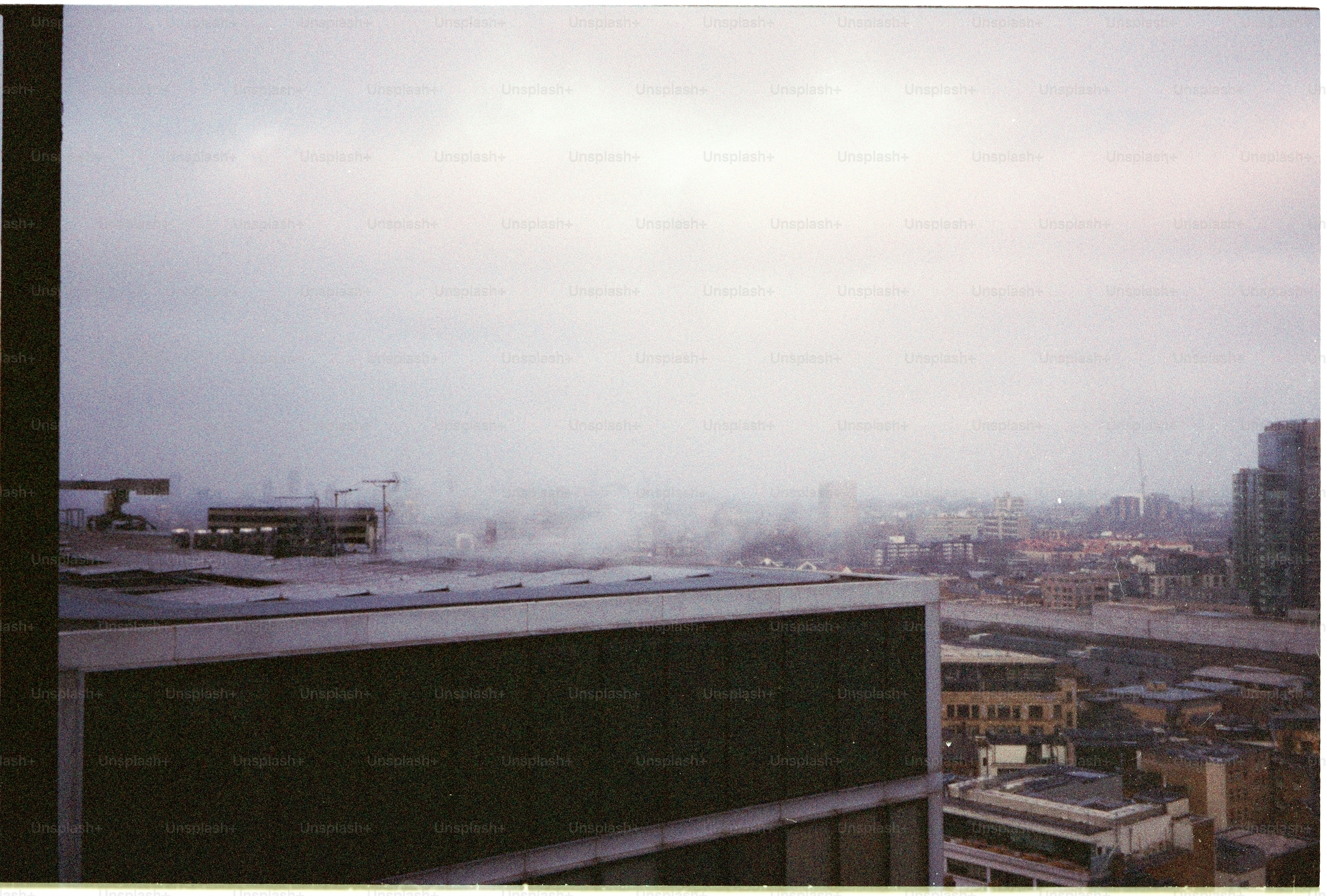 City skyline obscured by heavy fog or clouds
