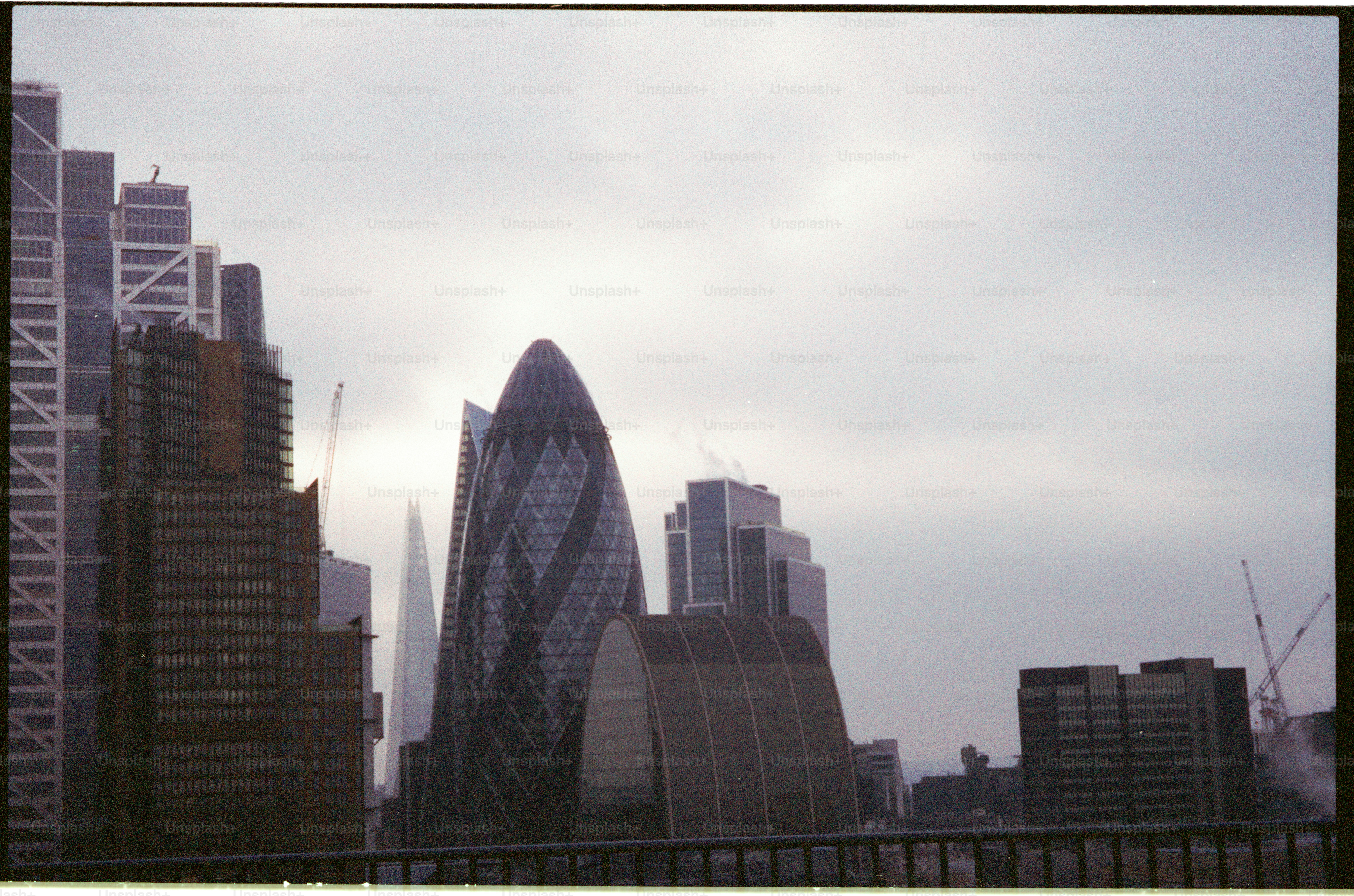 Modern skyscrapers in a city under a cloudy sky