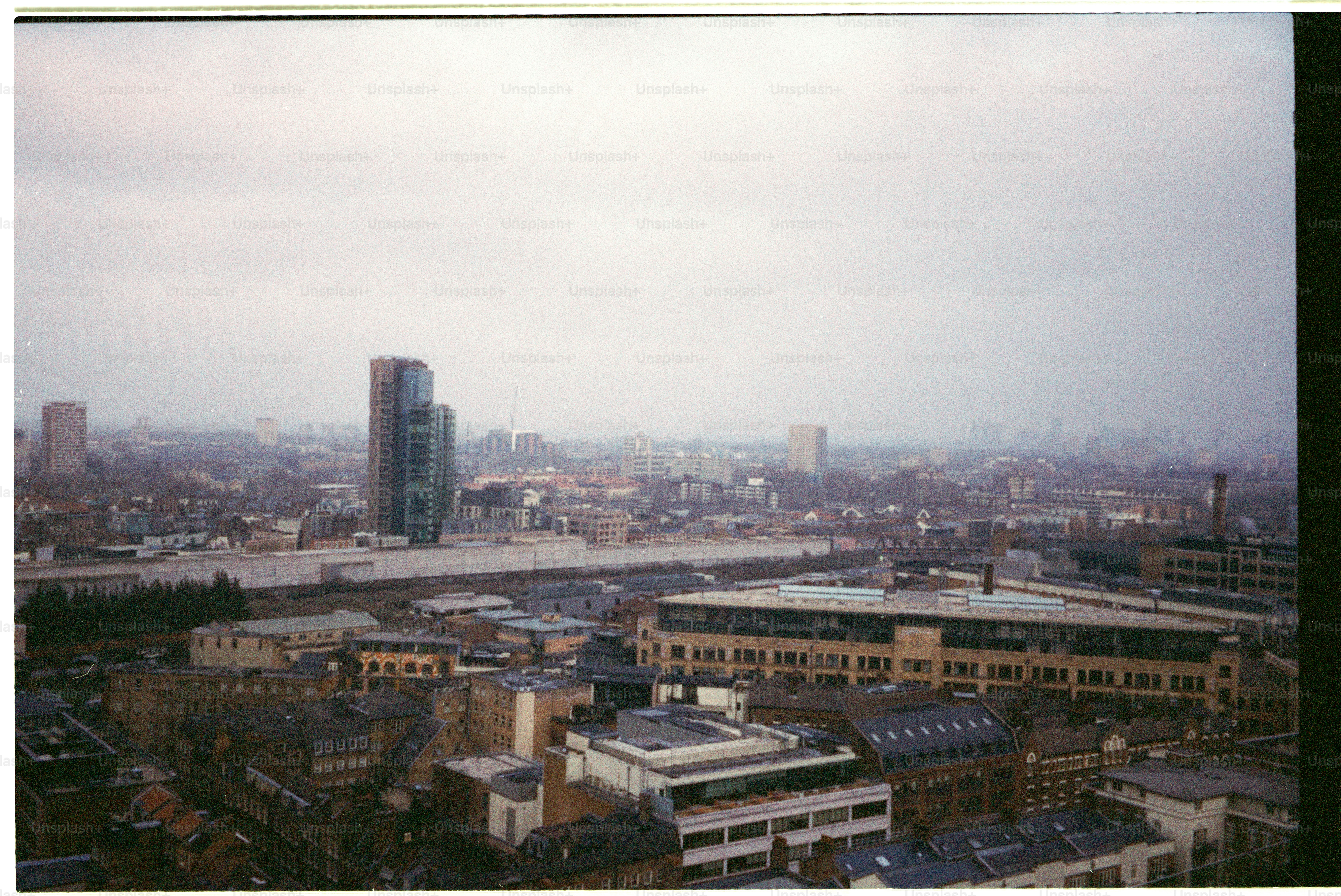 Overcast sky above a sprawling city skyline.