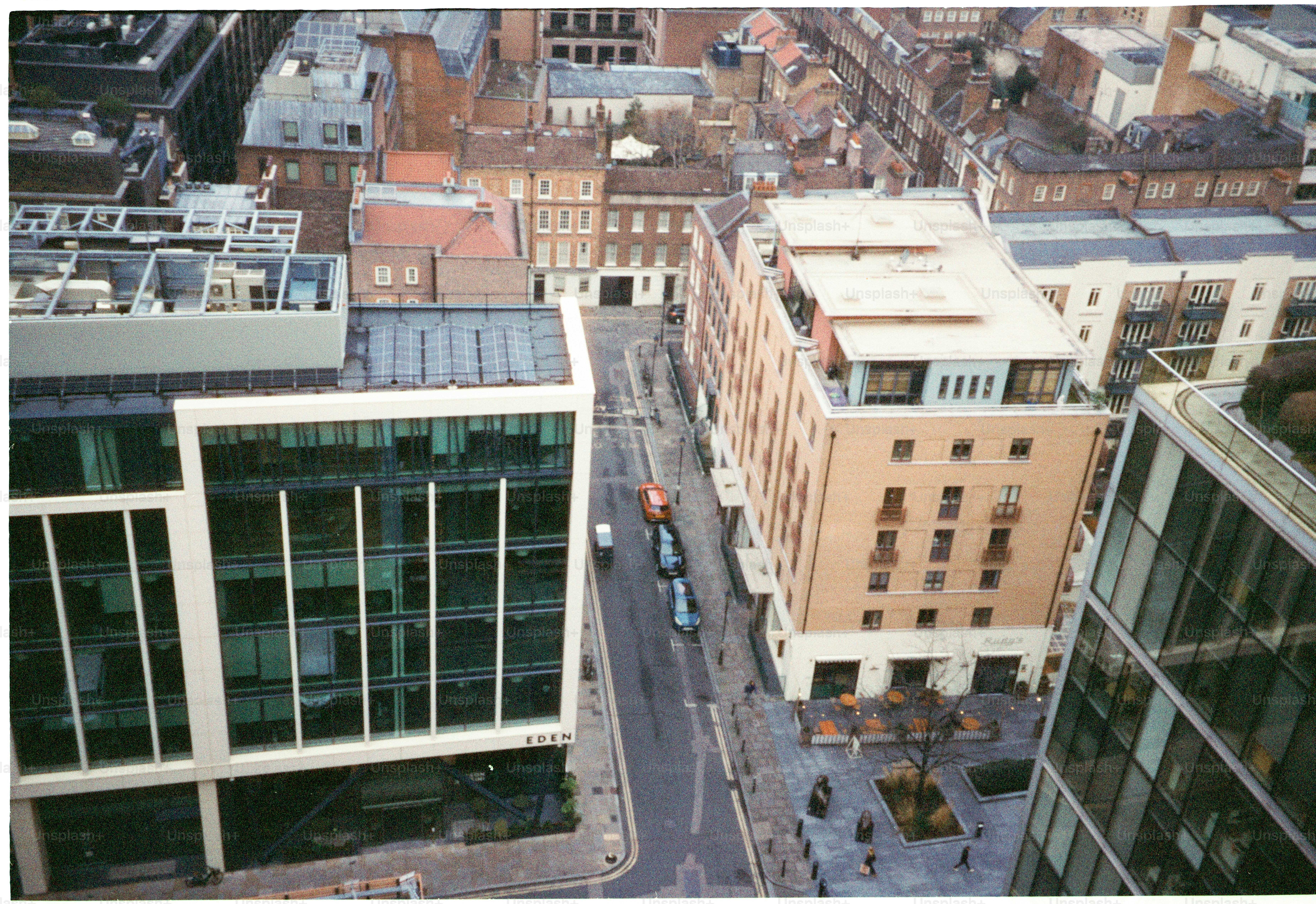 Aerial view of a city street with modern buildings.