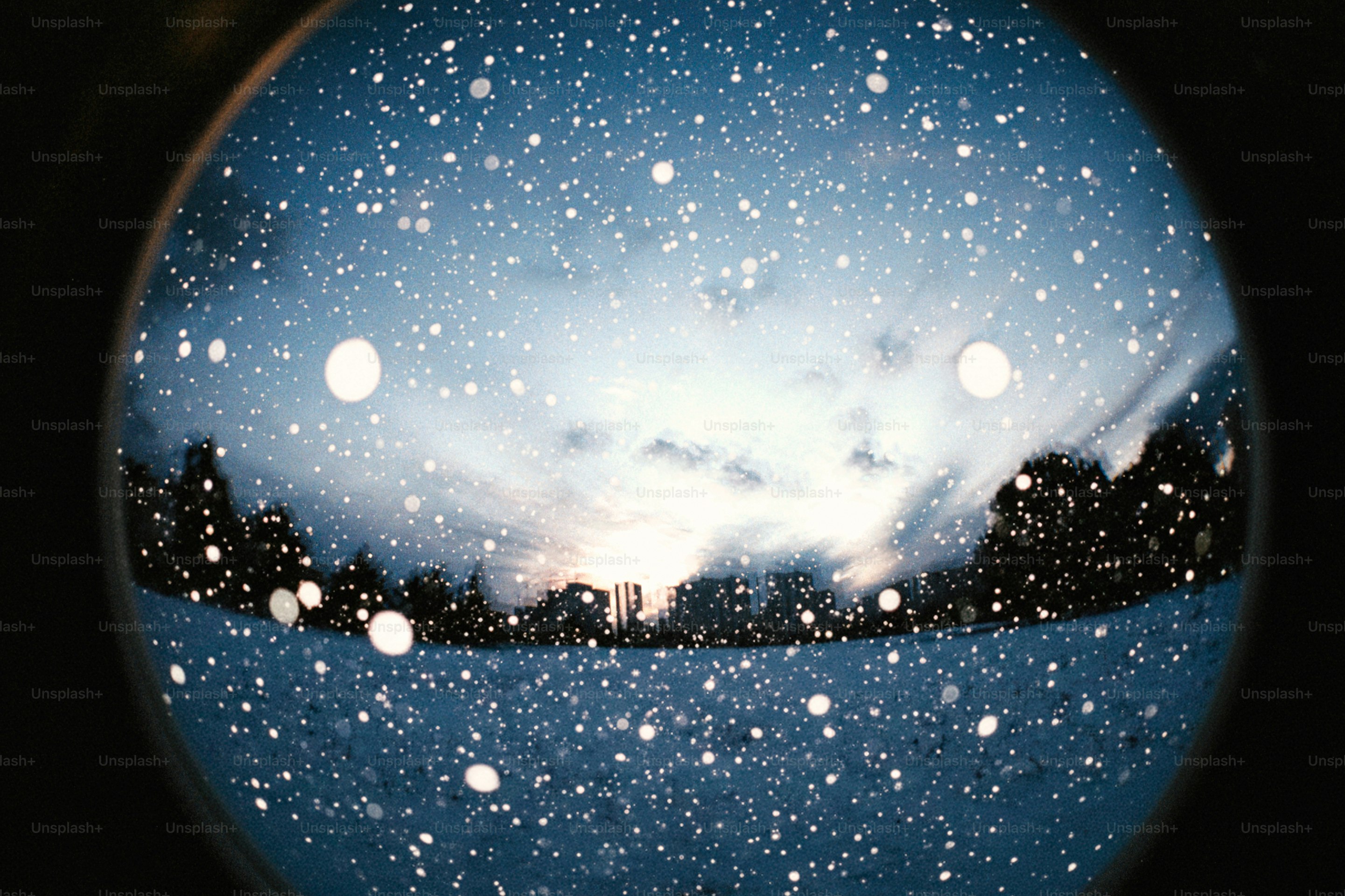 Snow falling on a winter landscape reflection