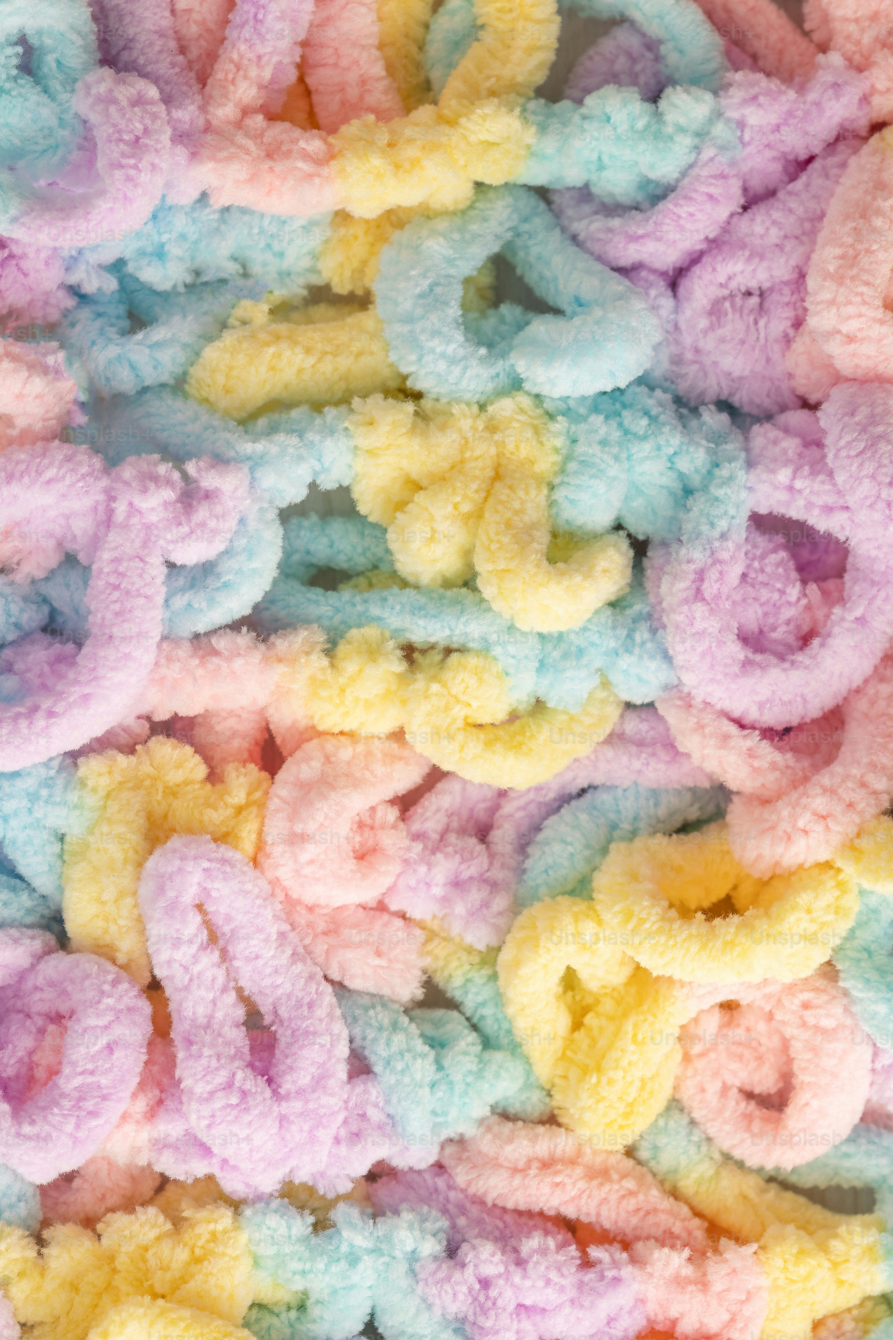 Soft pastel yarn with loops in pastel colors photo – Background Image ...