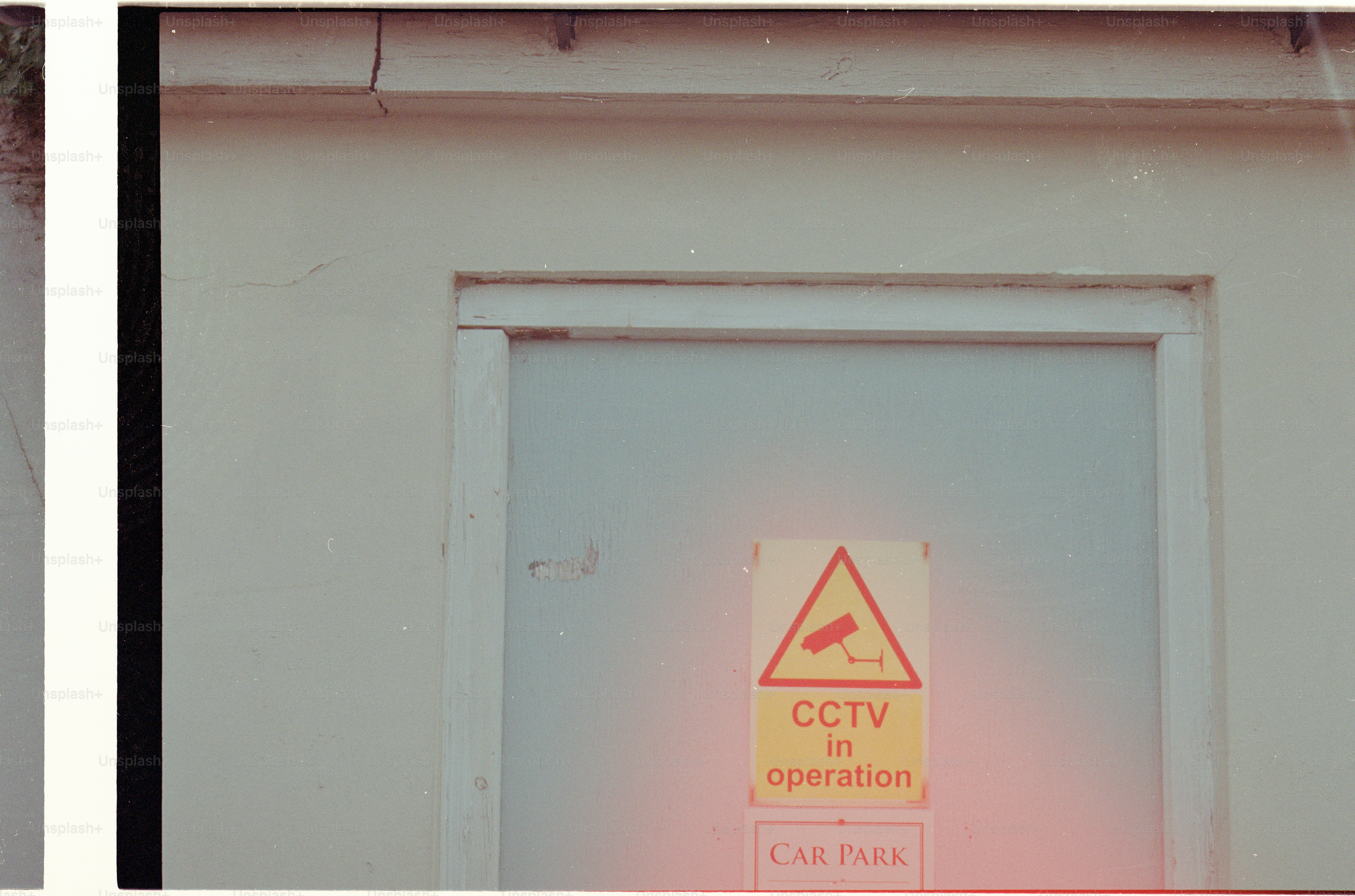 Door with cctv in operation warning sign