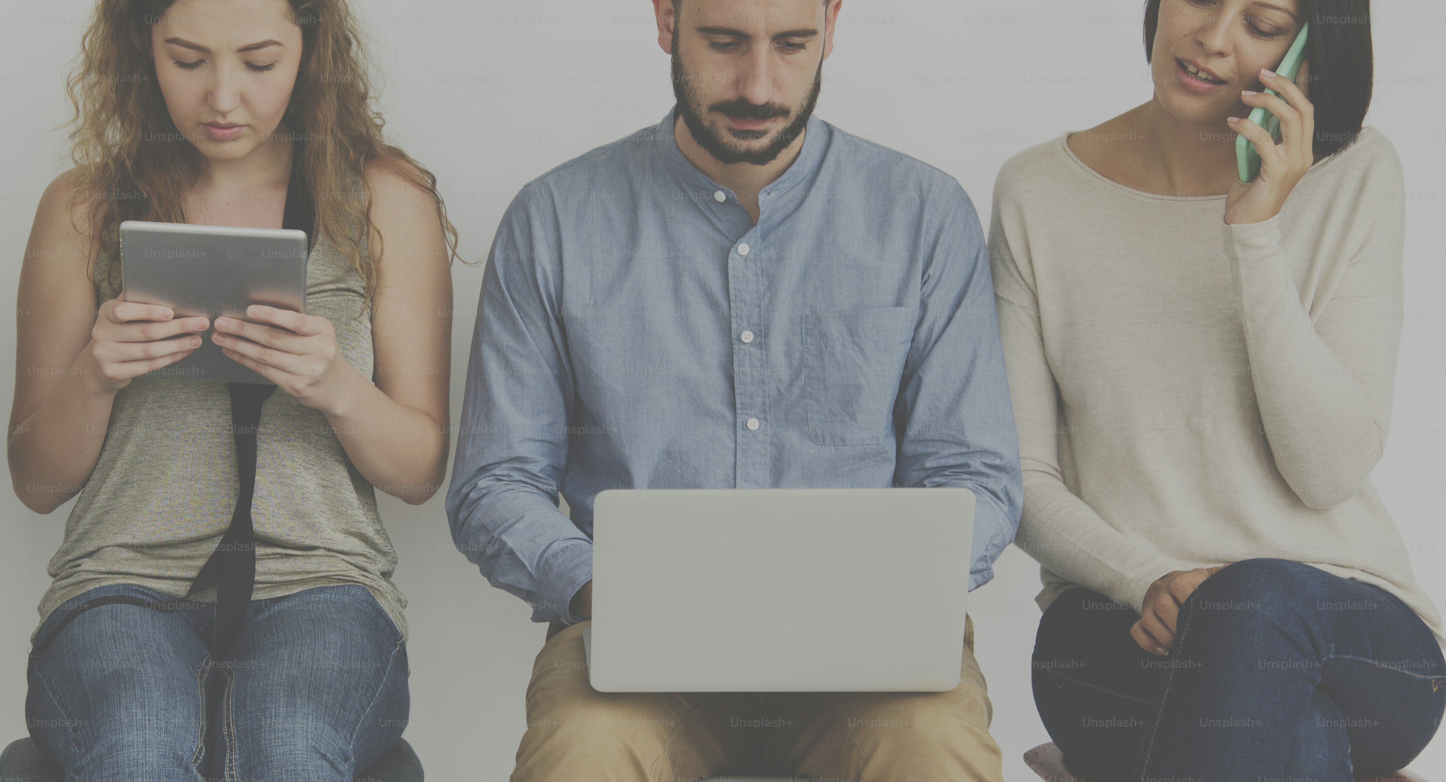 Diverse group of people with electronic devices
