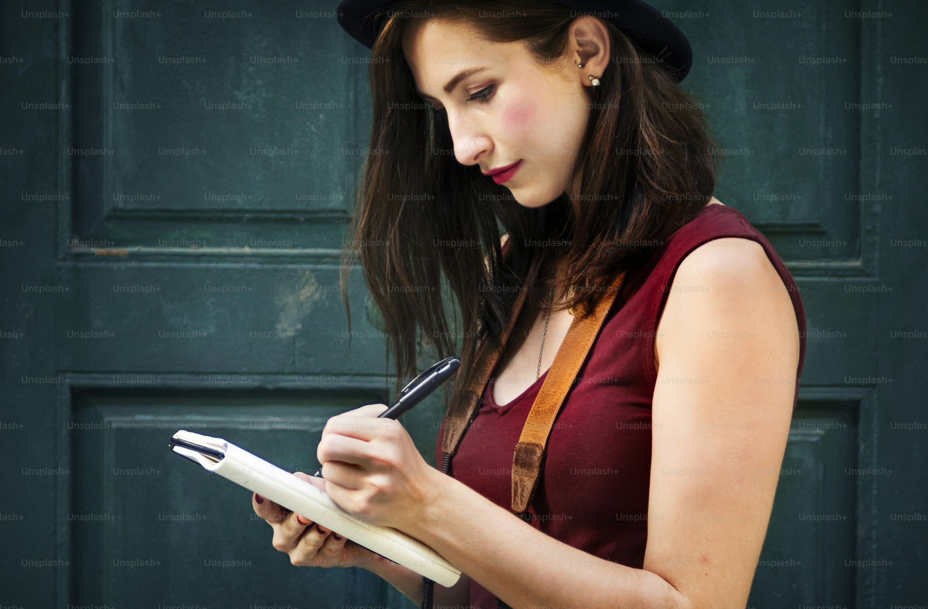 Woman Making Notes Outside City Concept