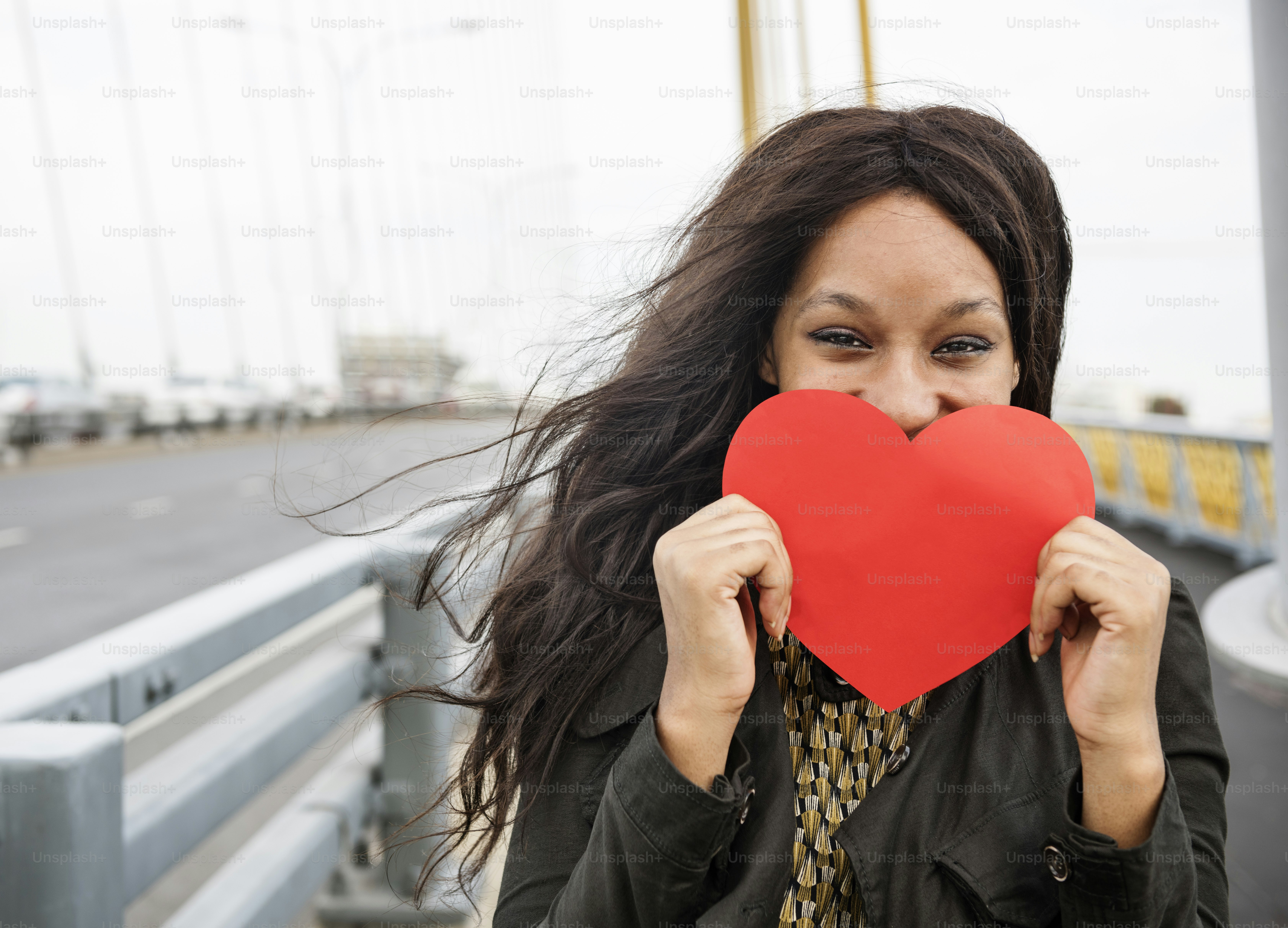 African Woman Holding Heart Shape Symbol Love Concept