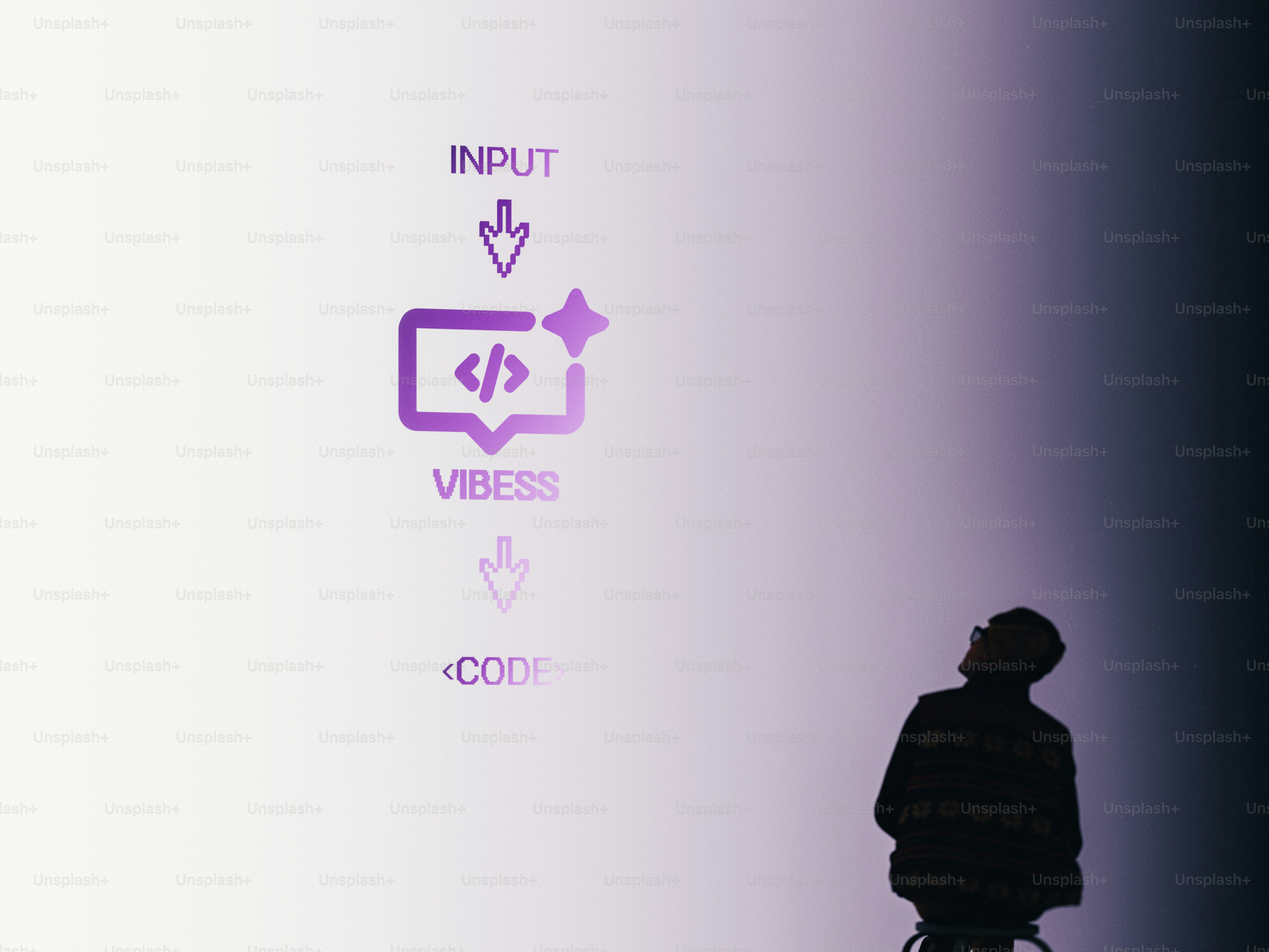 Man looking up at input to code graphic