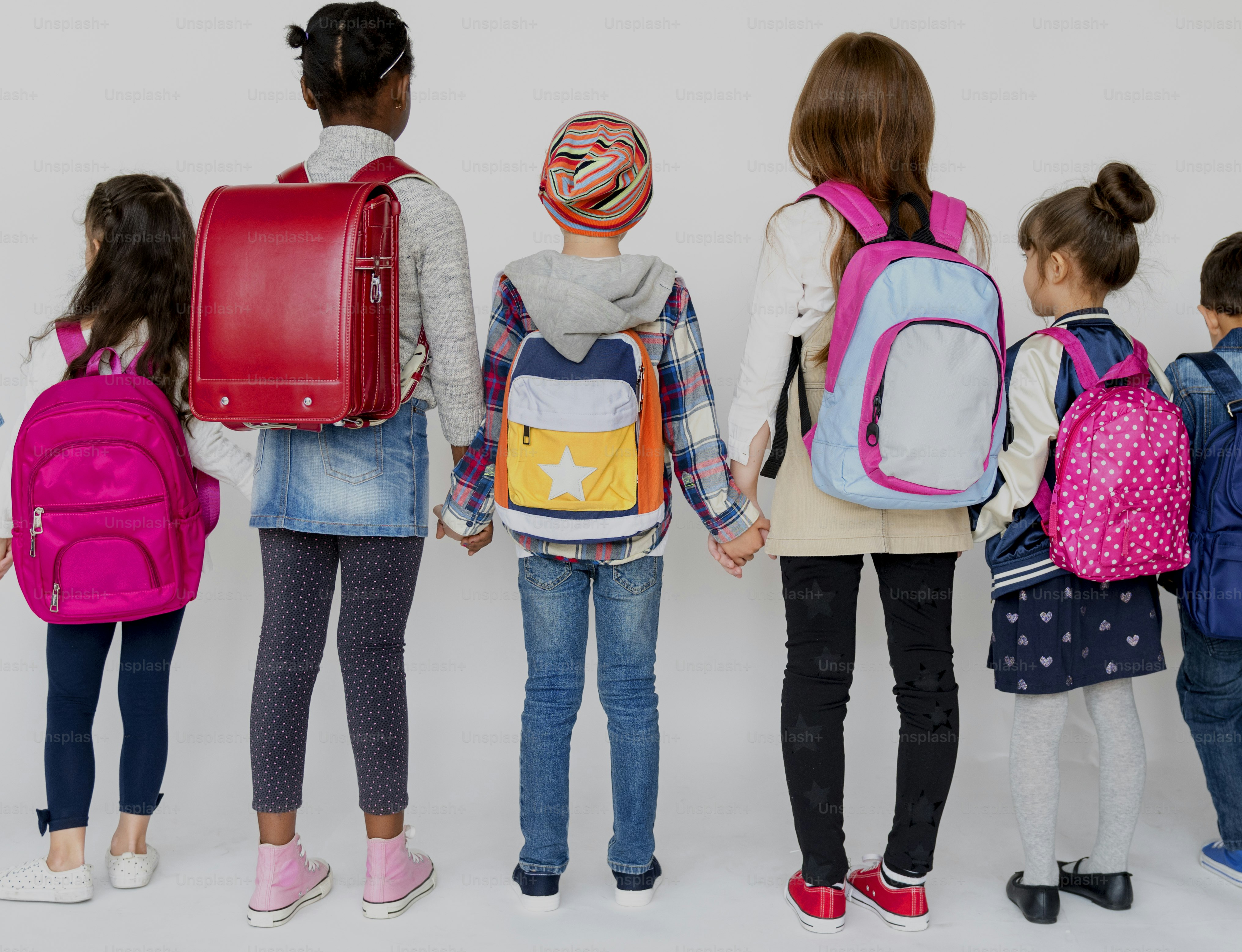 Group of Schoolers Kids with Backpack Behind Rear View on White Blackground