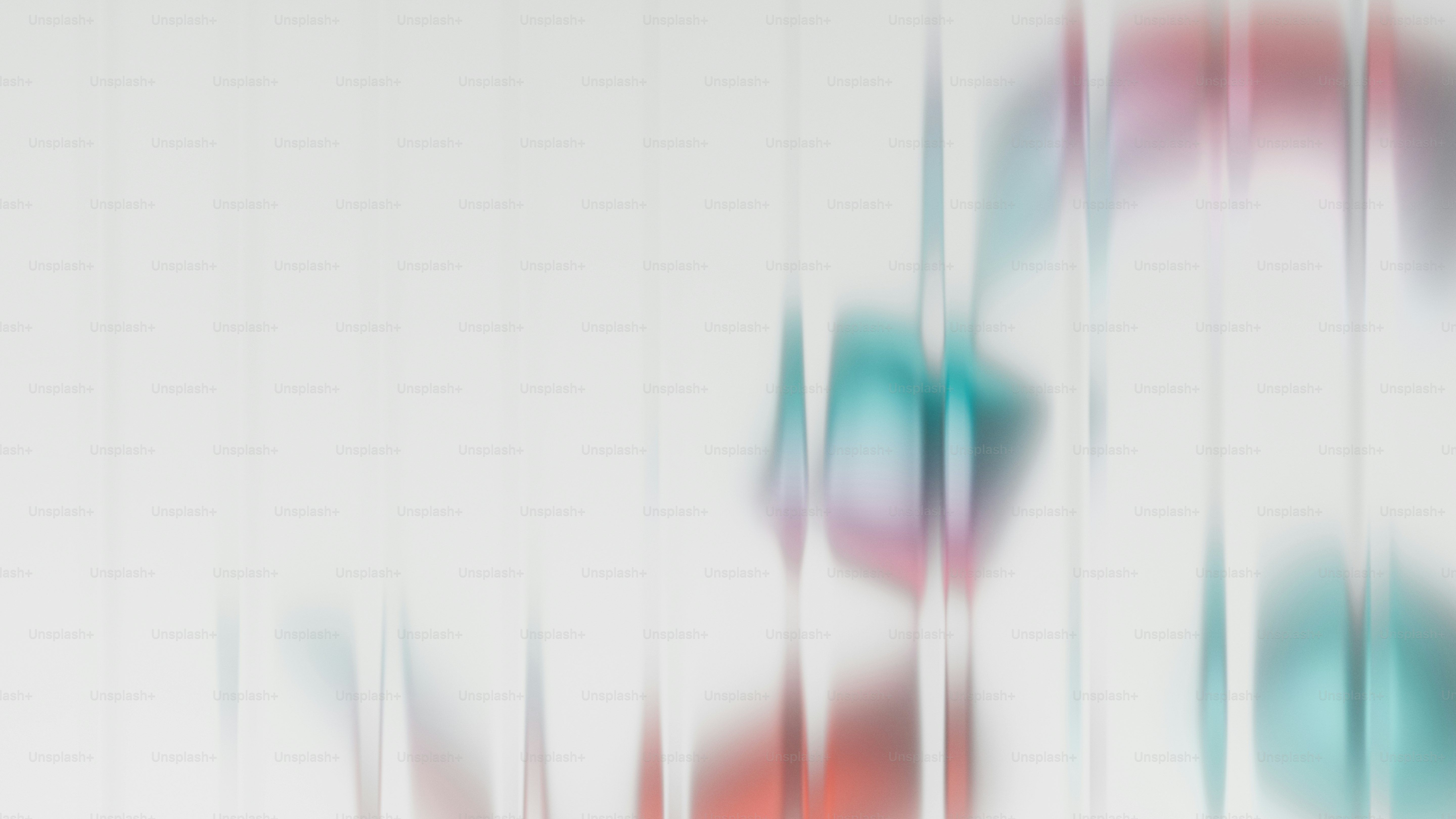 Abstract blurred shapes with red and teal colors