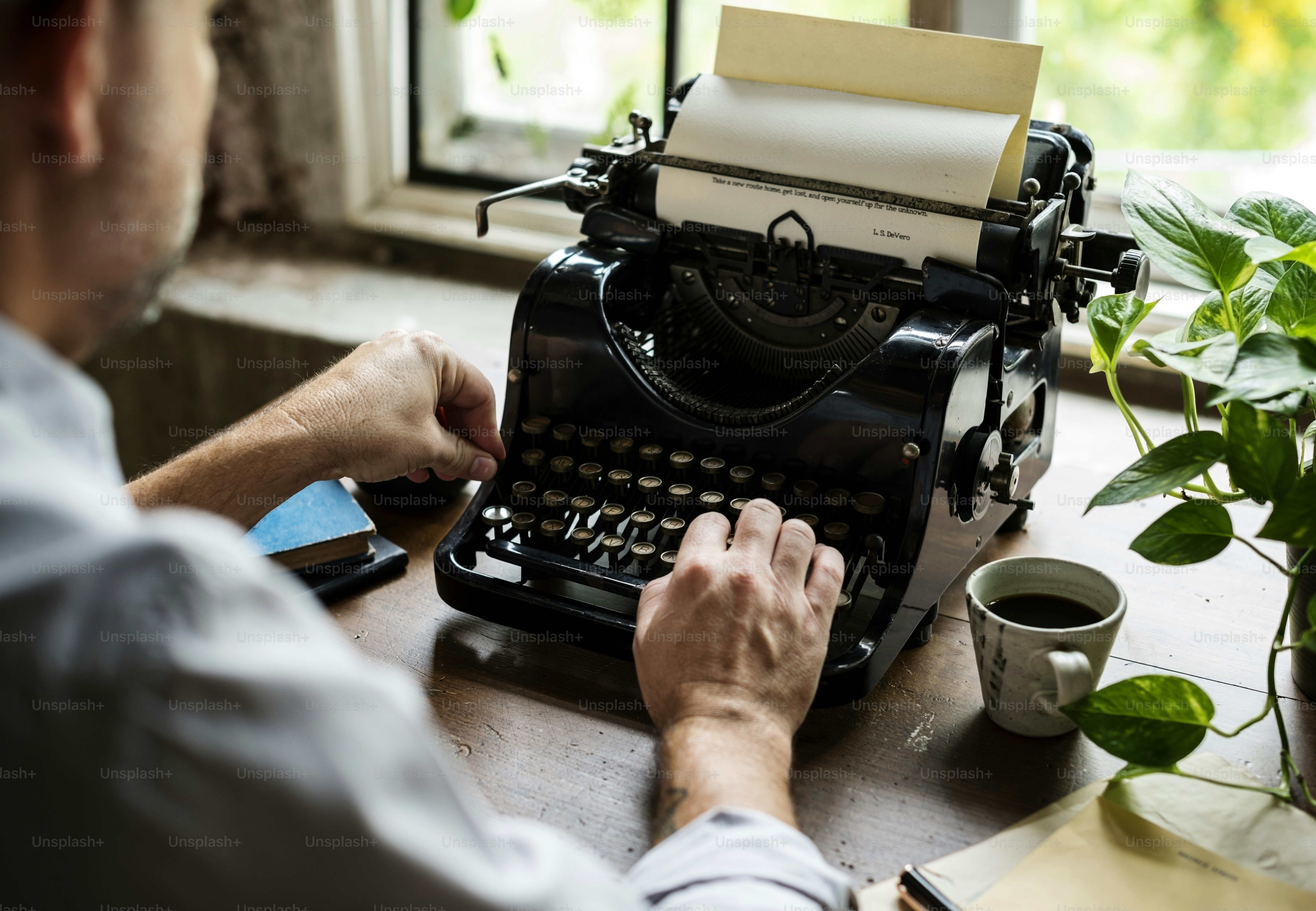 best AI agents for freelance writing 2026 — Man Using Typing Retro Typewriter Machine Work Writer