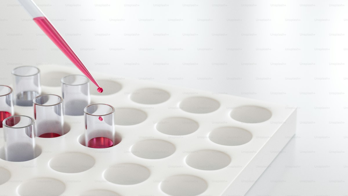 Pipette drops liquid into test tubes in a laboratory