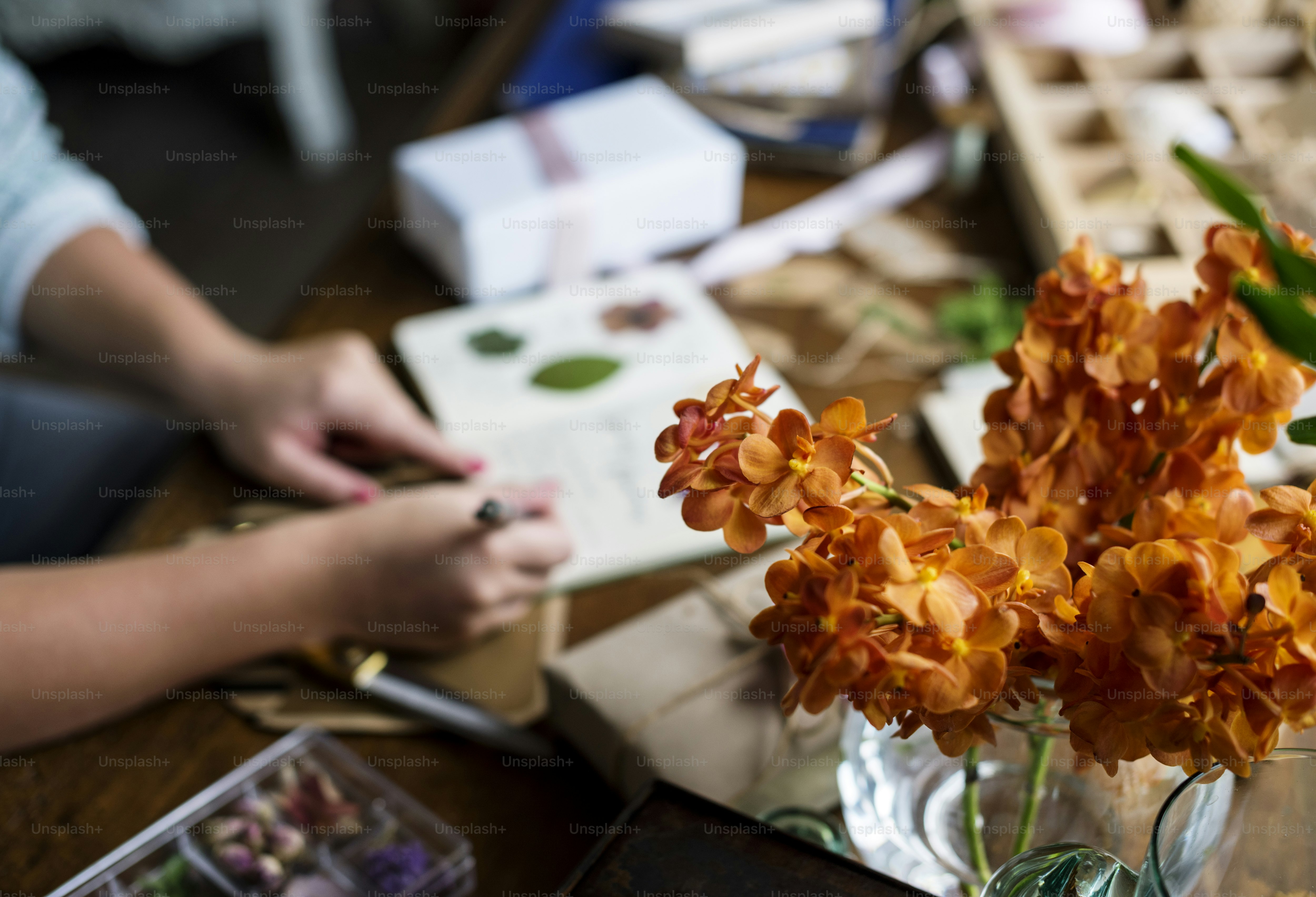 craft table featuring dried flower crafts and preservation supplies