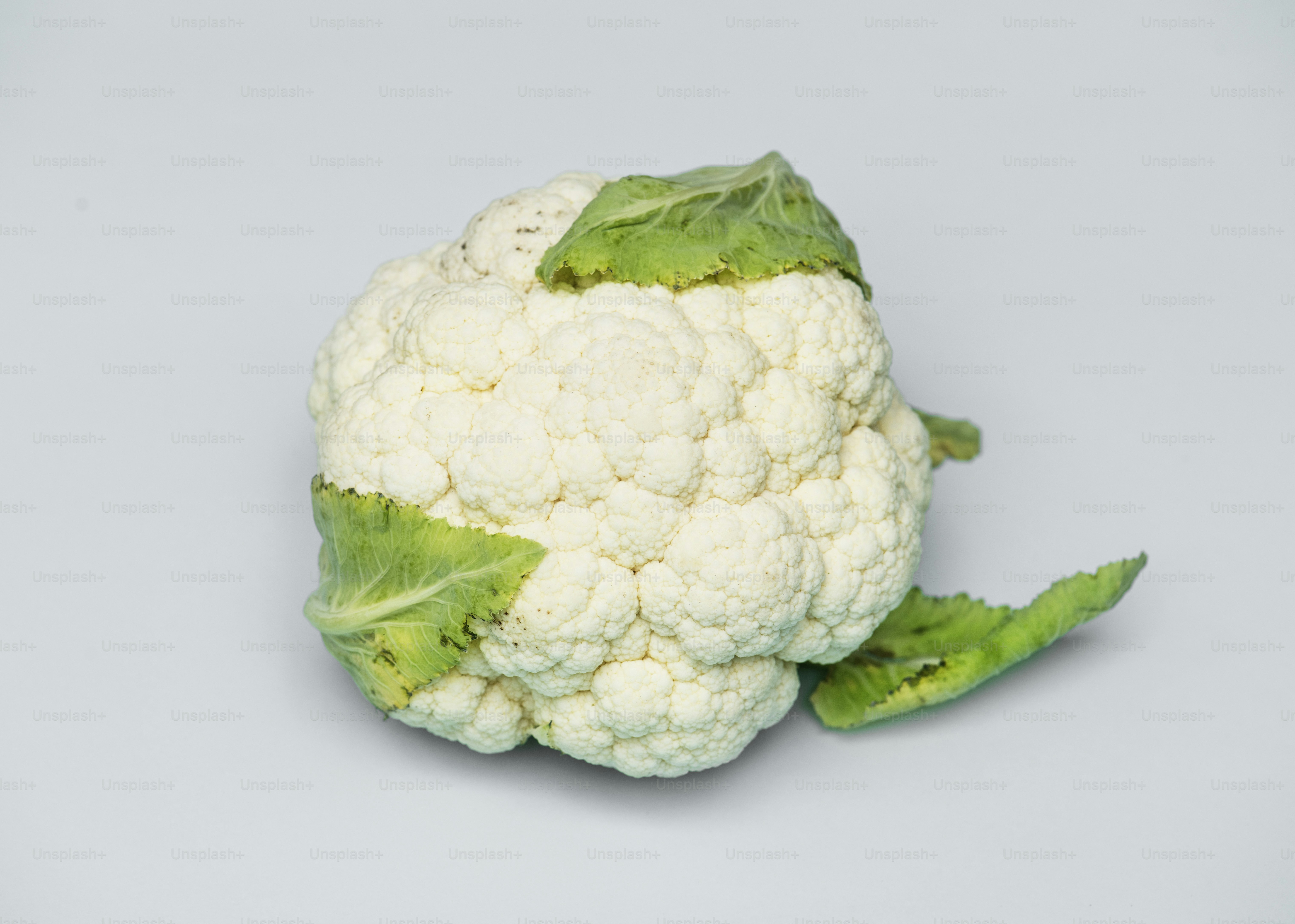 Closeup of fresh cauliflower on white background