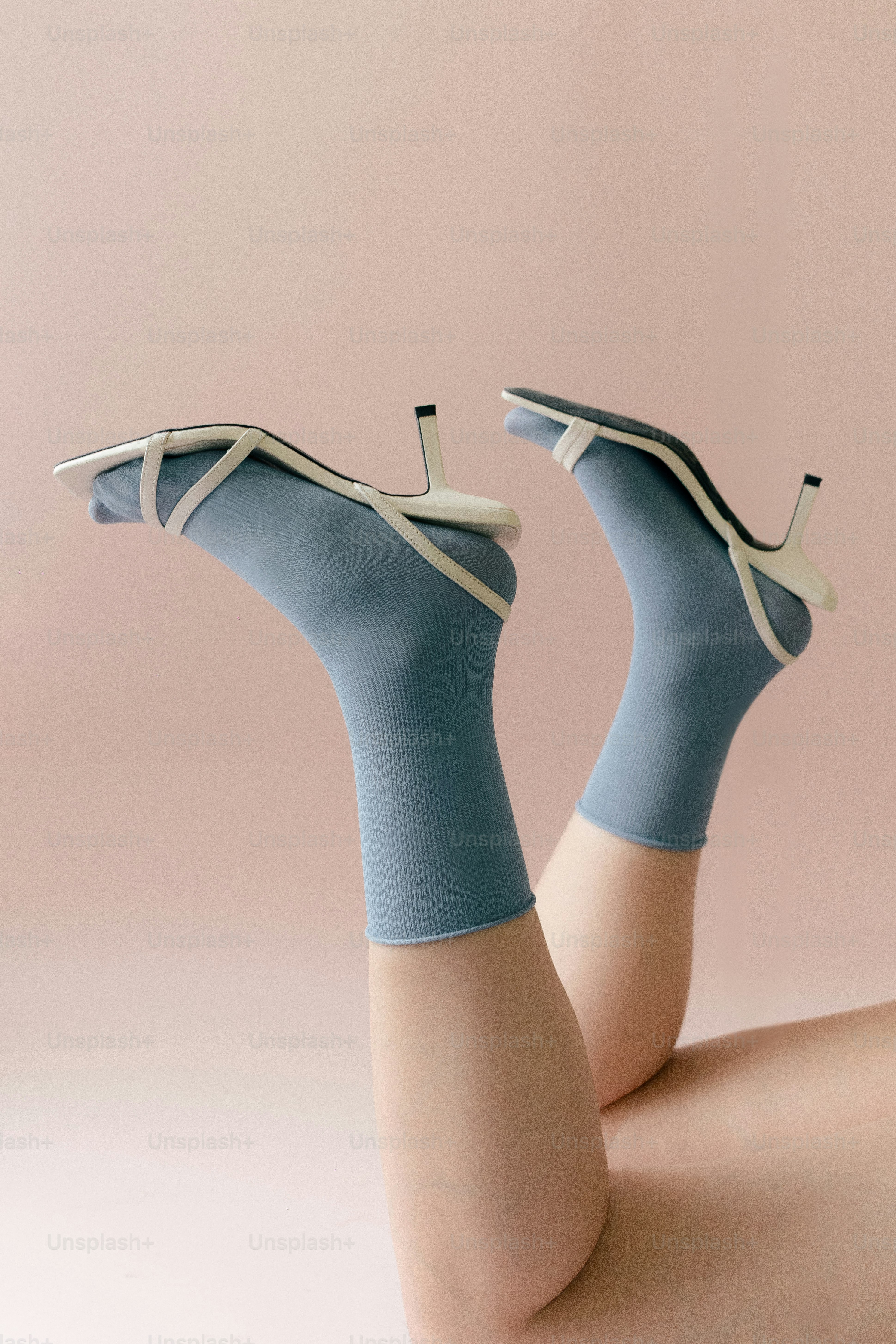 White heels with blue socks on legs