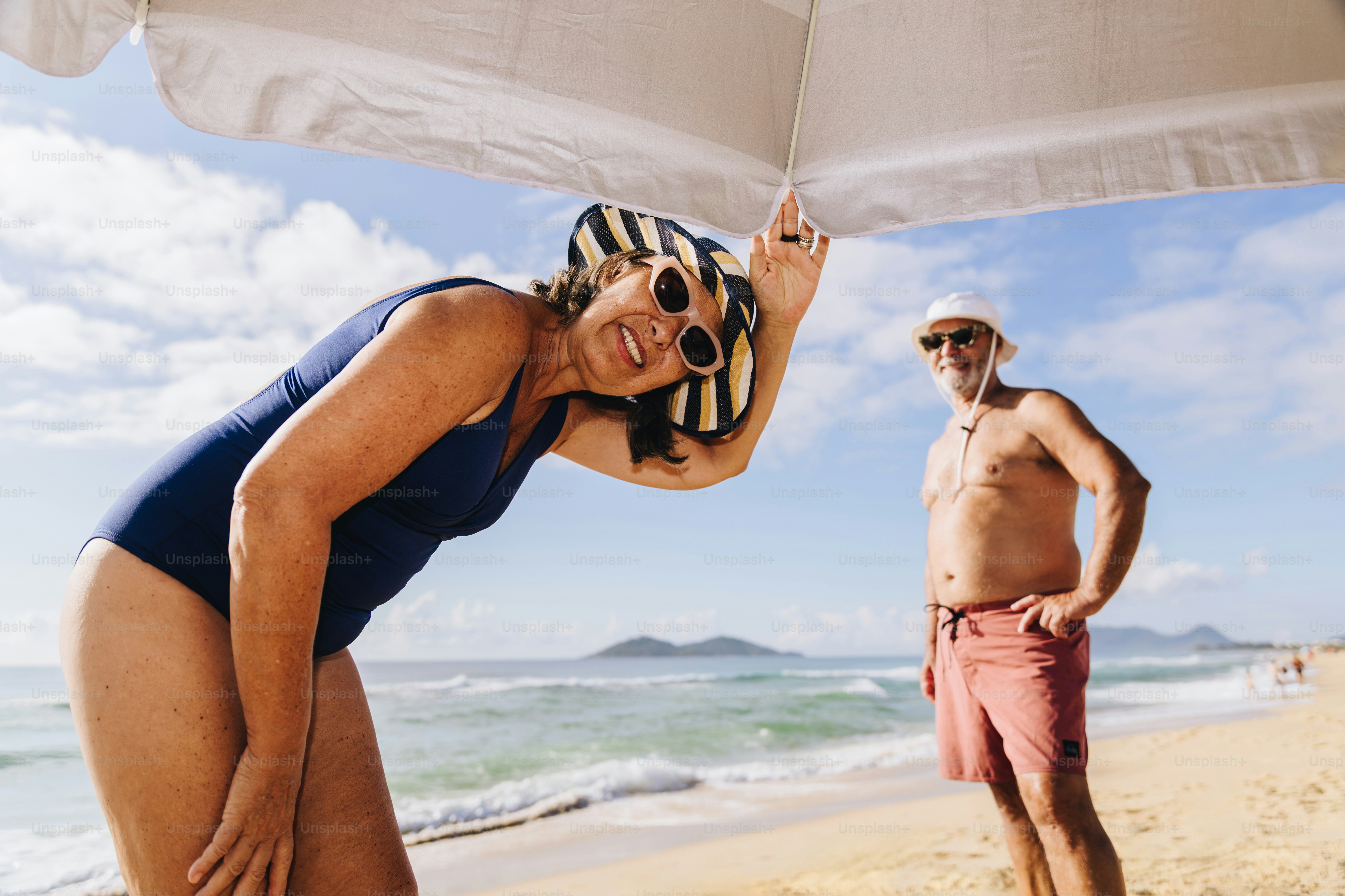 Elderly couple enjoying a sunny day at the beach