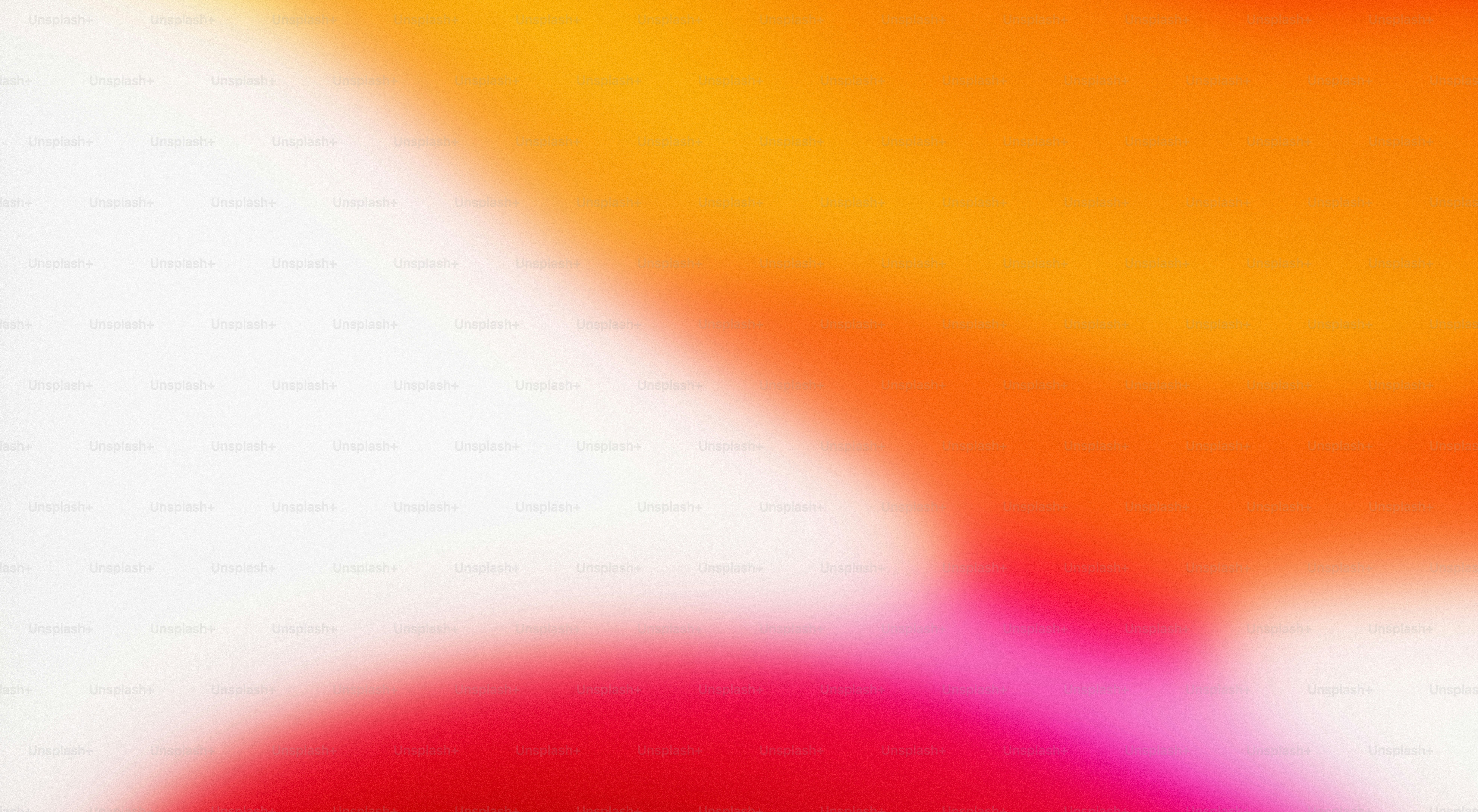 Abstract blend of white, orange, and pink colors.