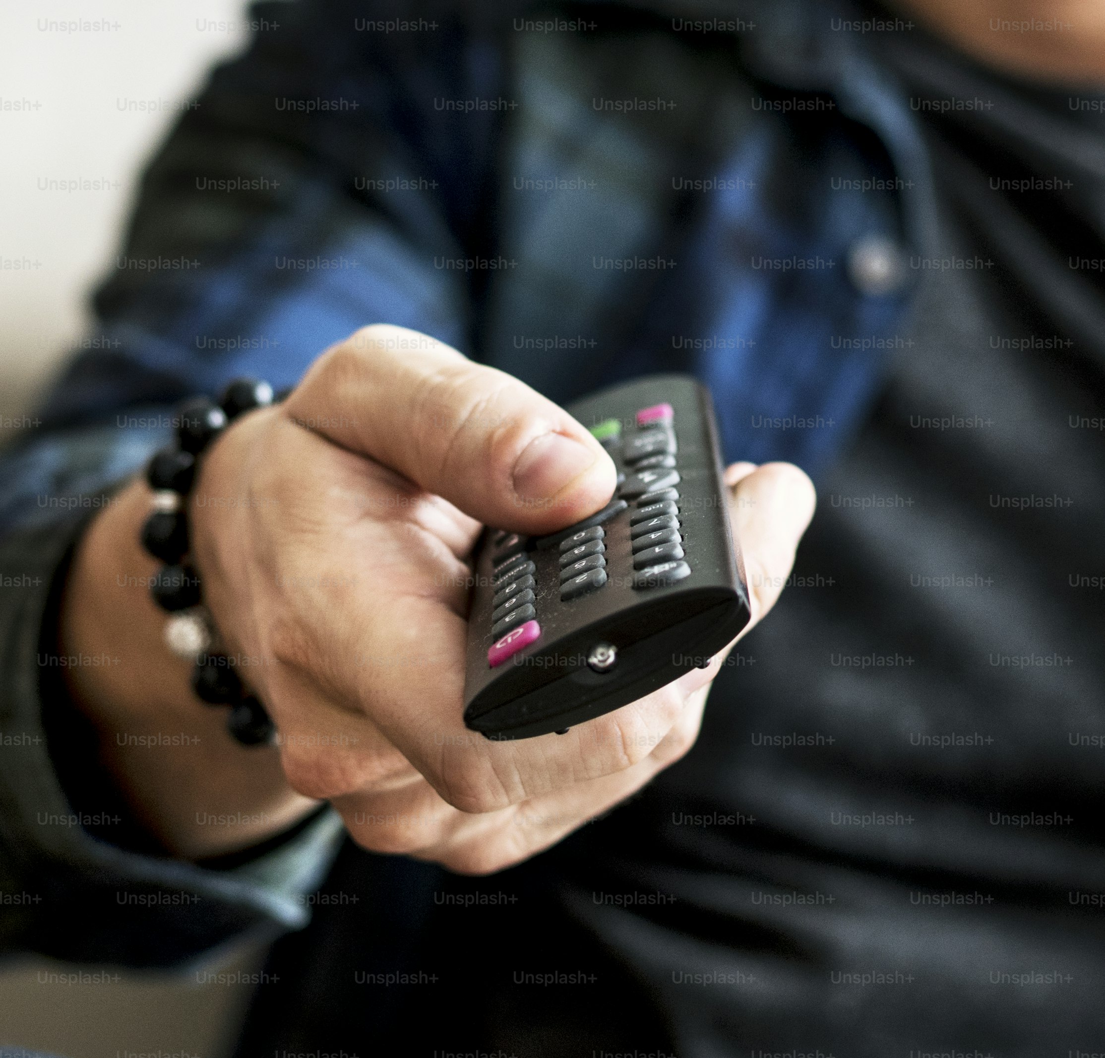 Hand carrying a remote controller photo – Hand Image on Unsplash