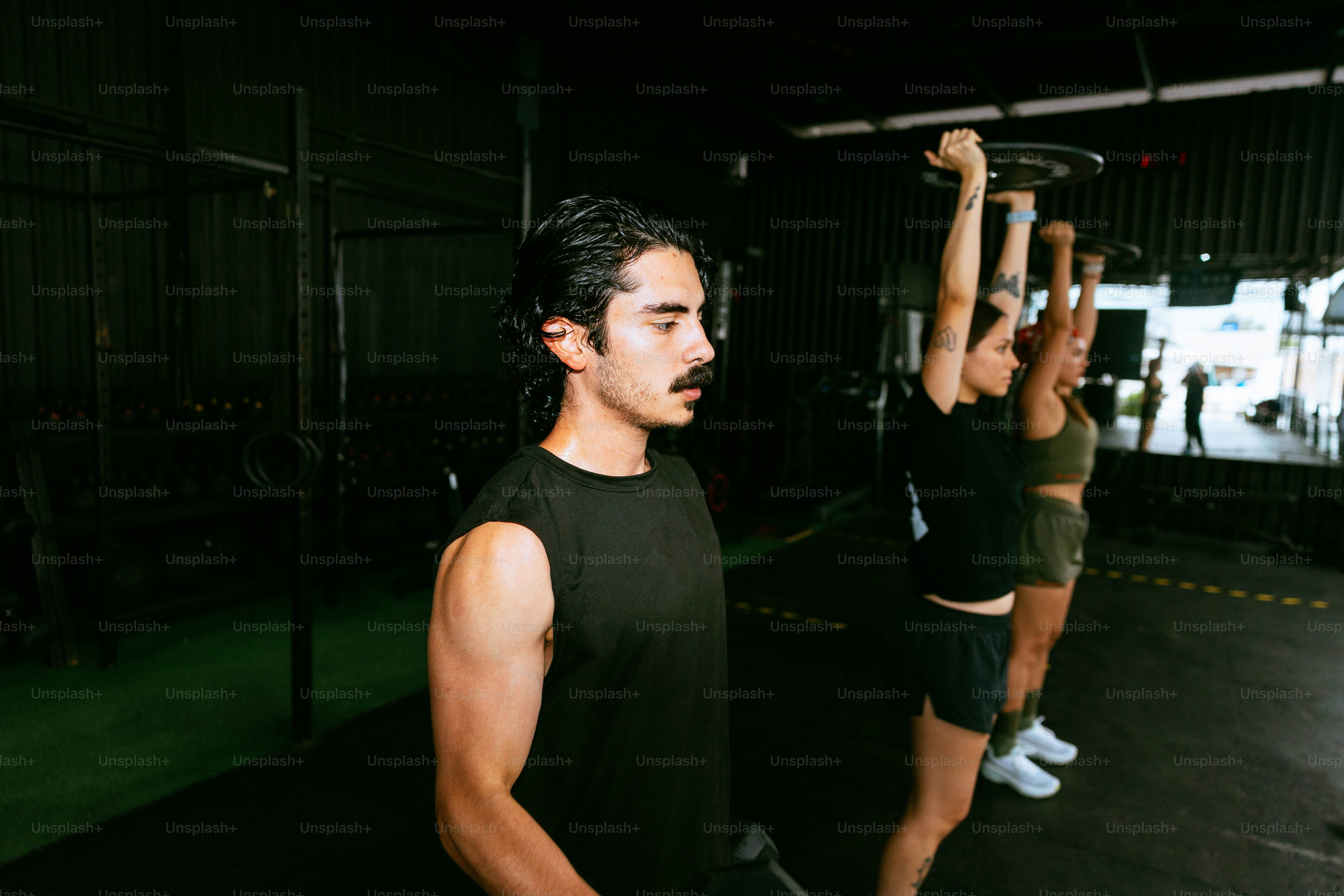 People lifting weights in a gym