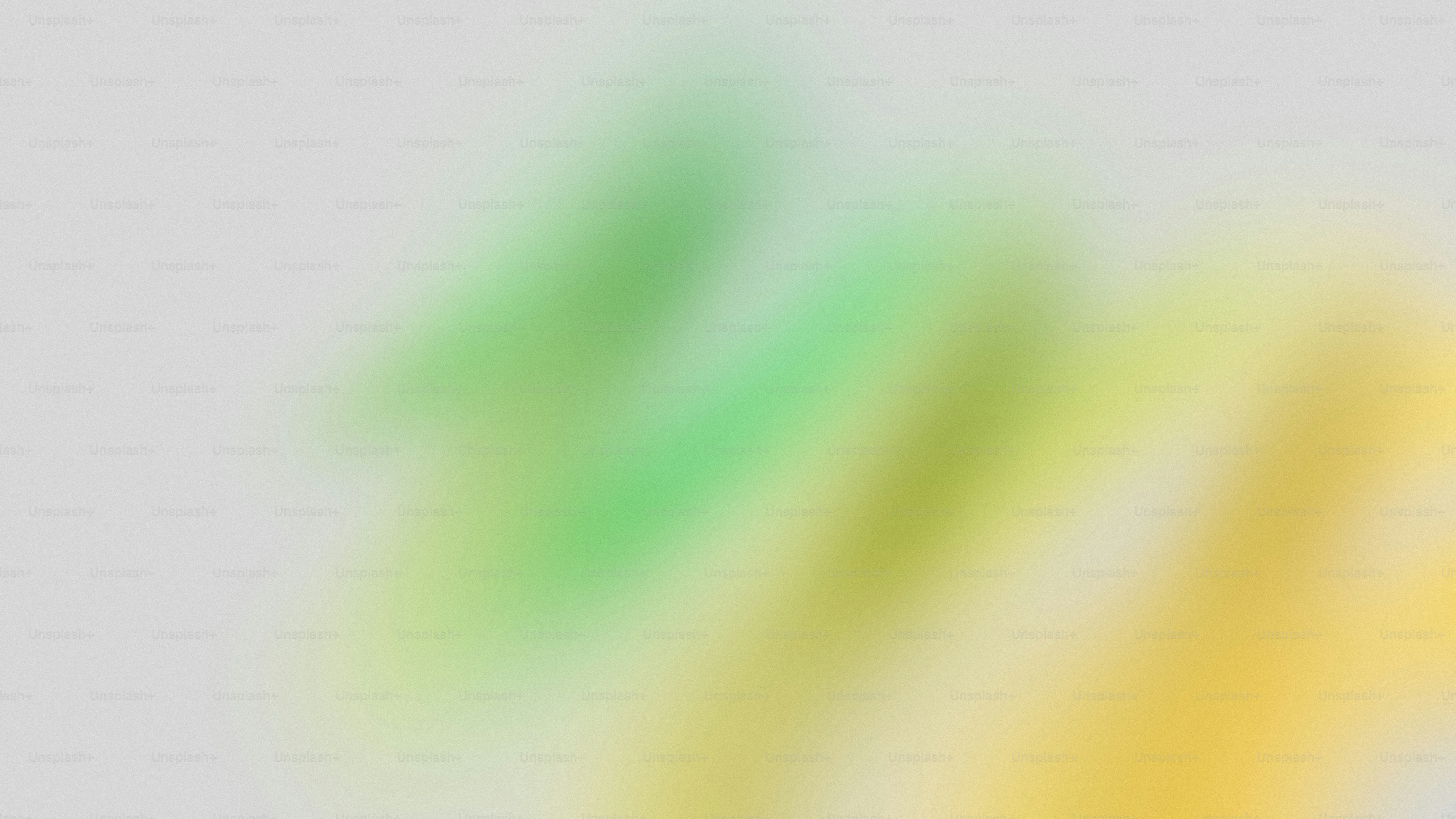 Abstract blurred green and yellow streaks on gray