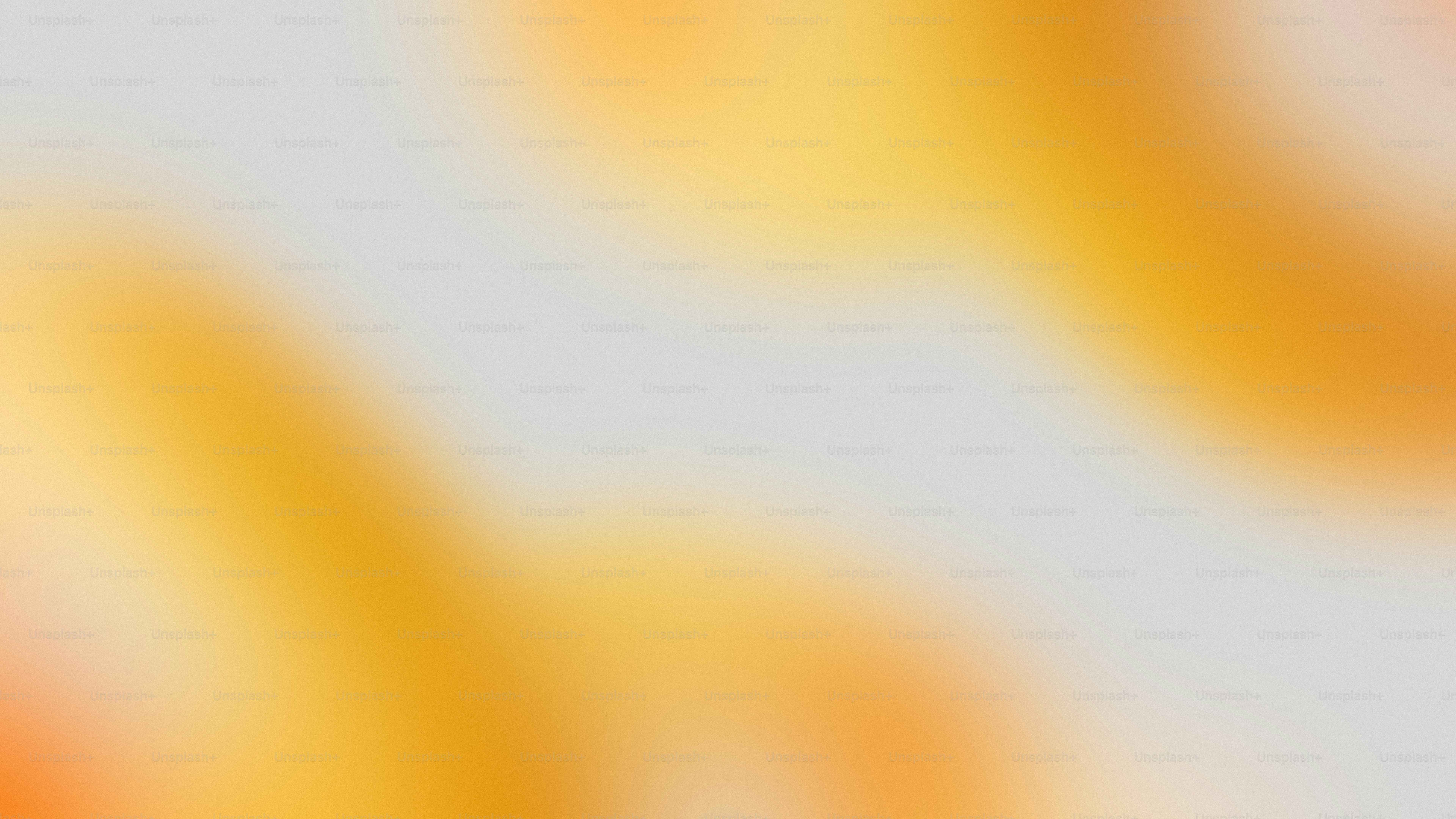 Soft orange and yellow blurs on a grey background