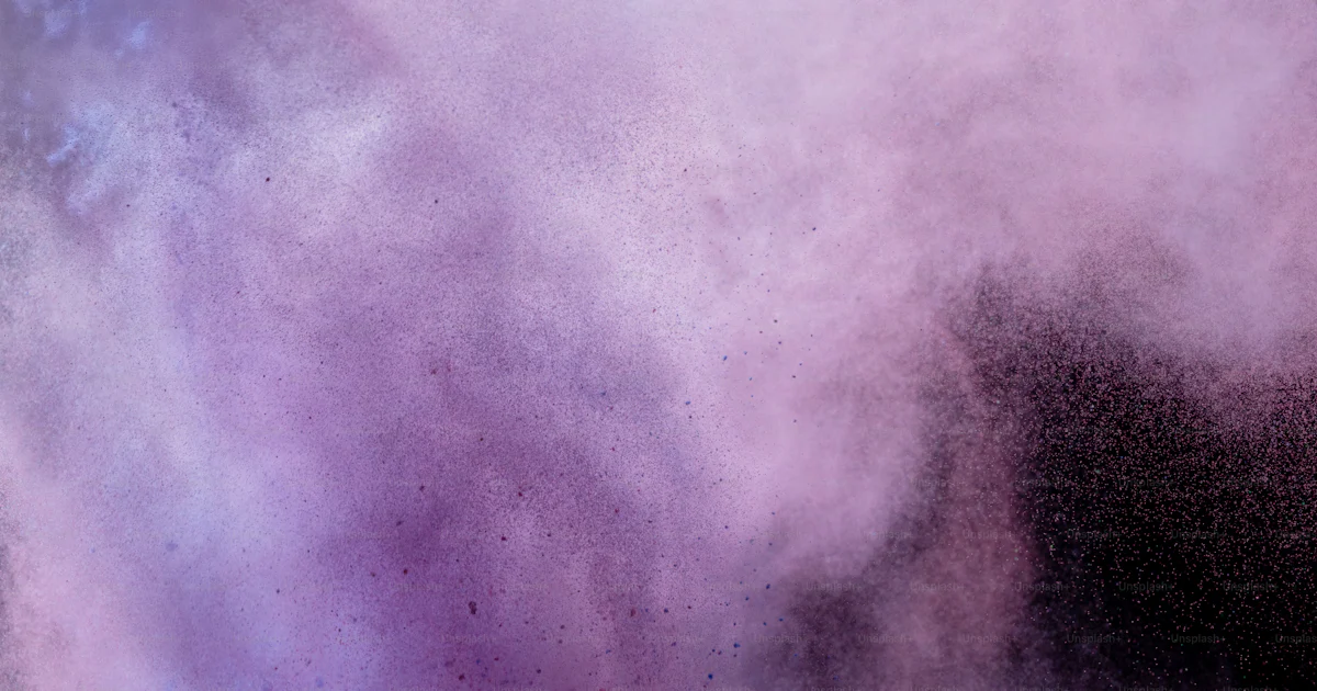 Pink and purple powder exploding against black background photo – Holi ...