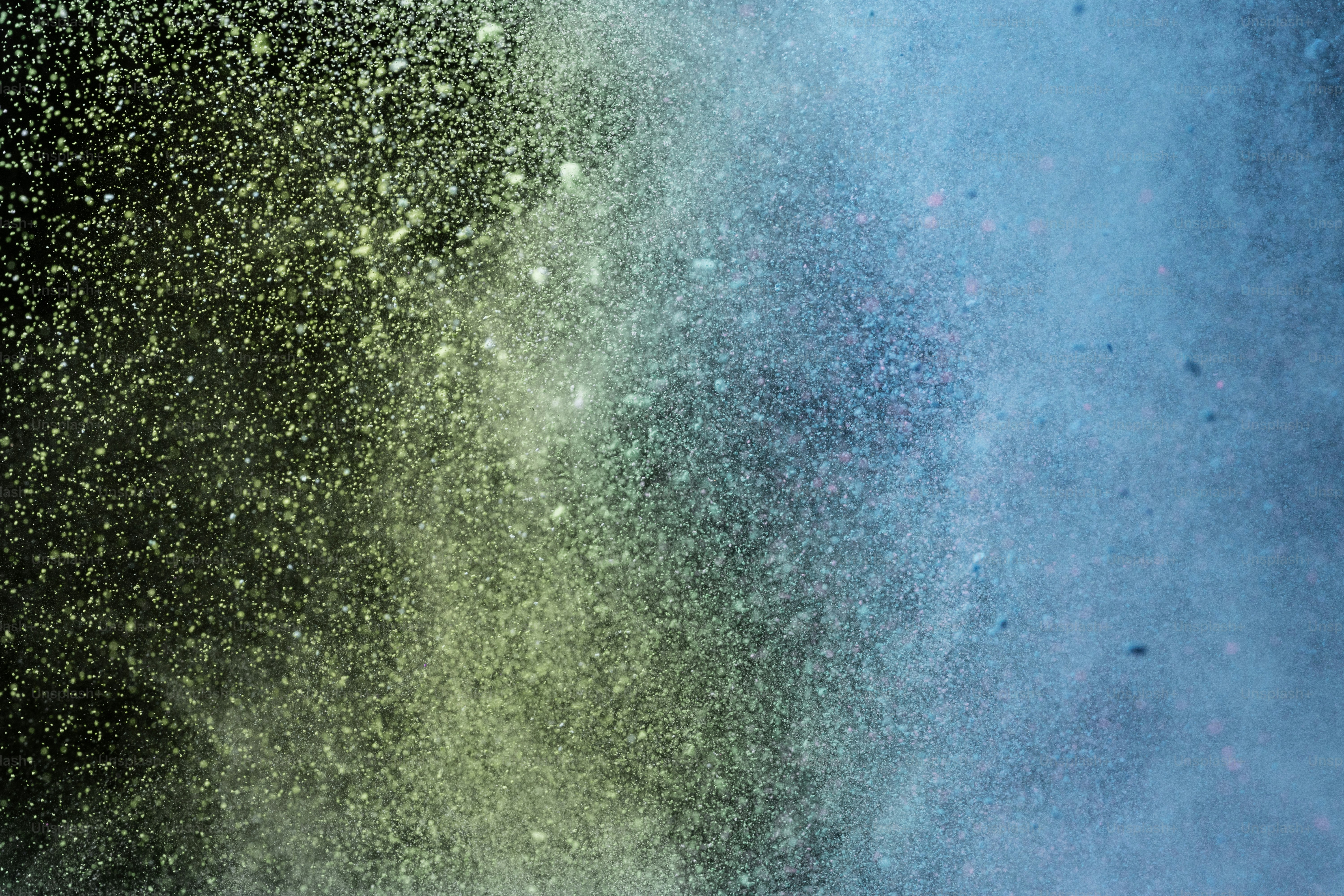 Abstract colorful powder explosion on a dark background photo – Texture ...