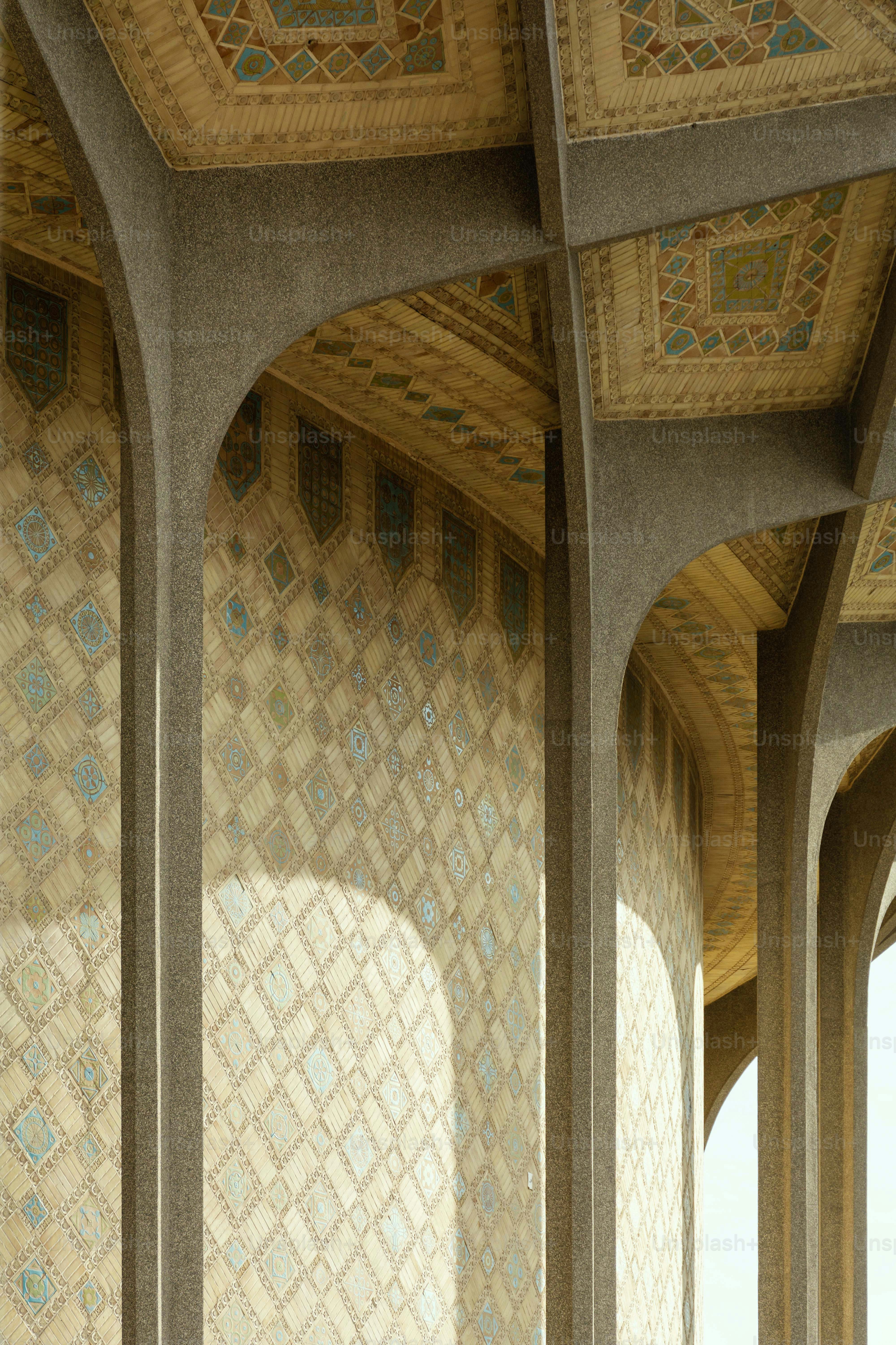 Intricate geometric patterns adorn building arches and ceiling