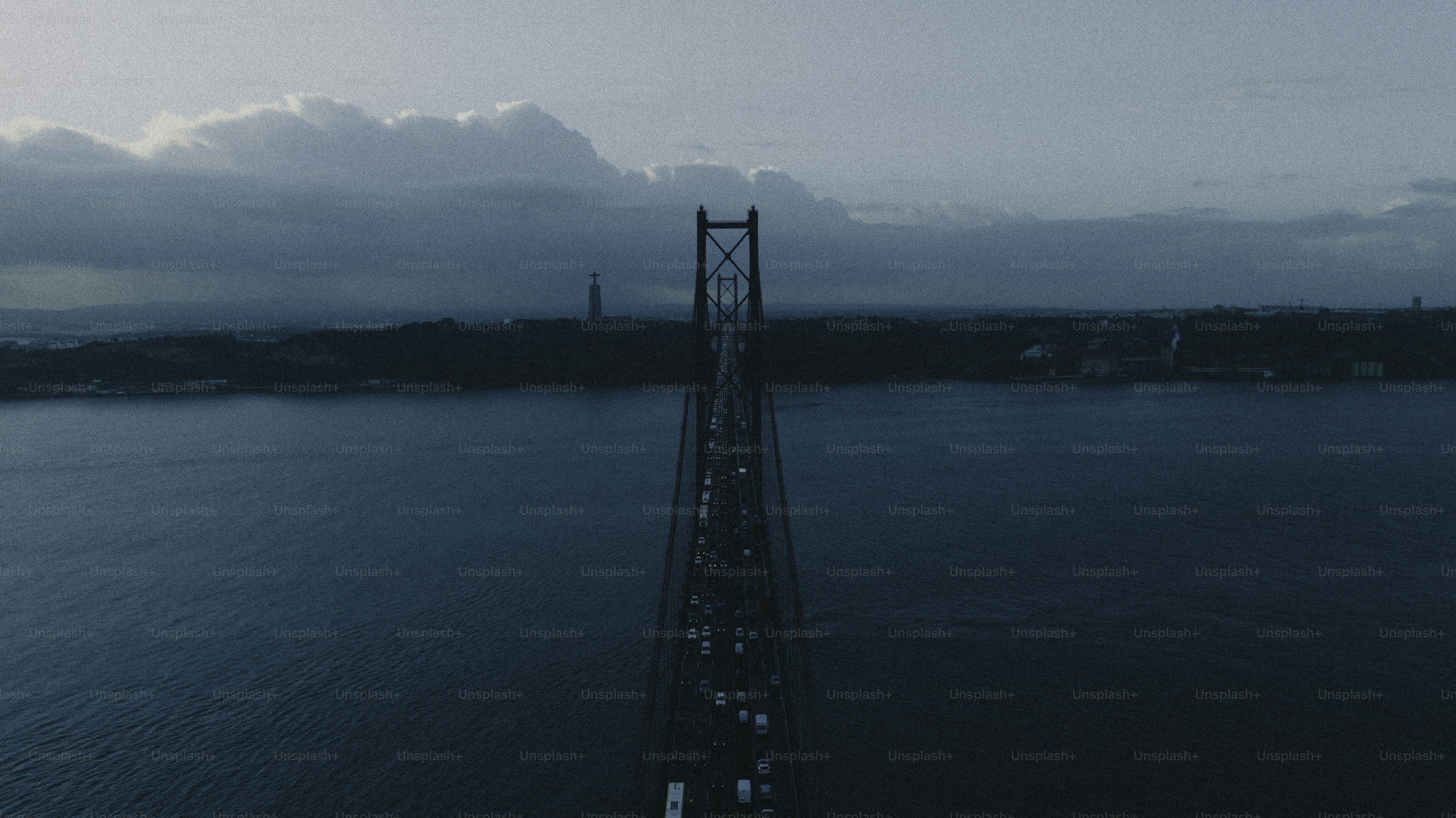 A long bridge over a wide body of water.