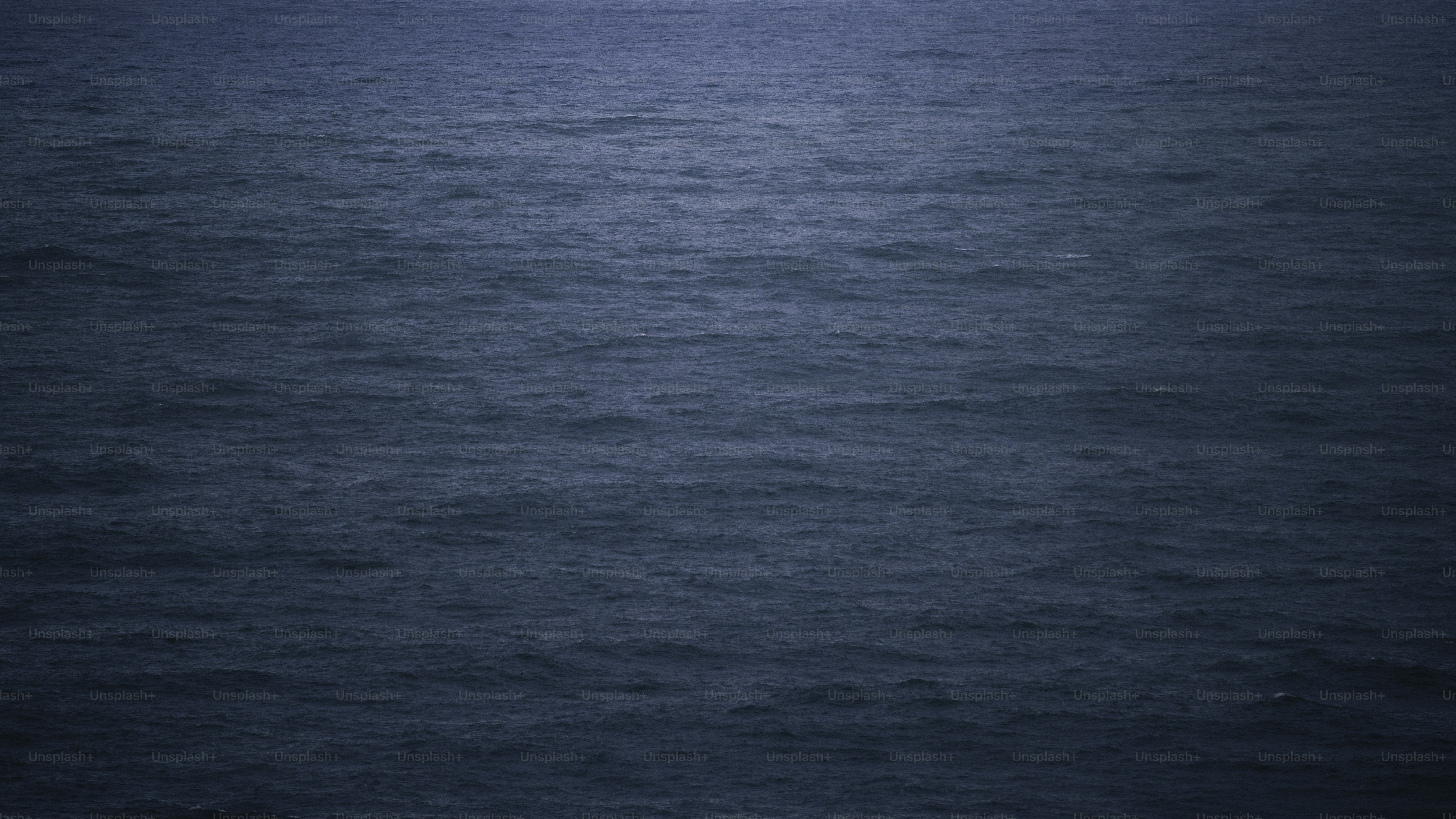 Dark blue ocean water with small waves