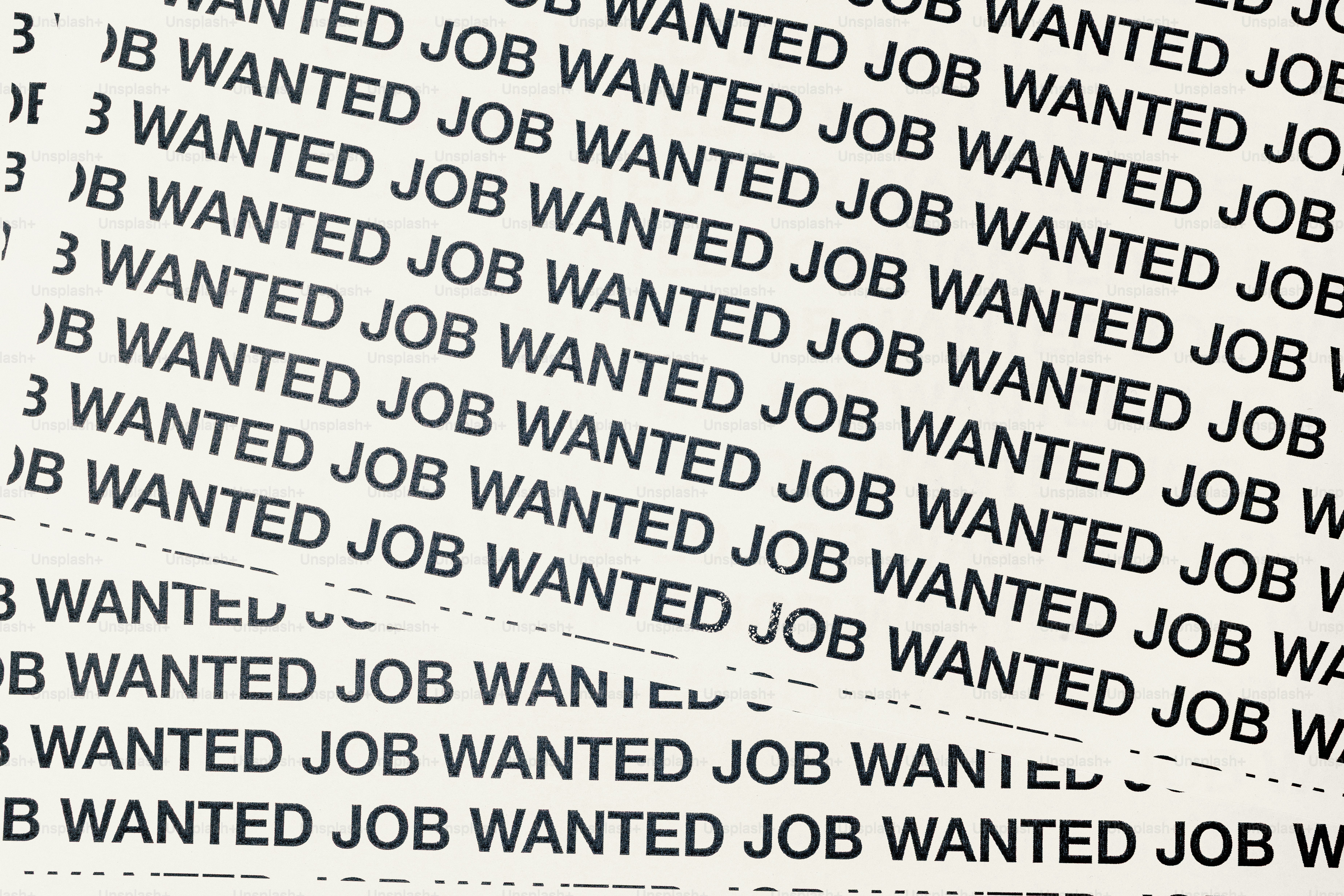 Pattern of "wanted job" text on paper