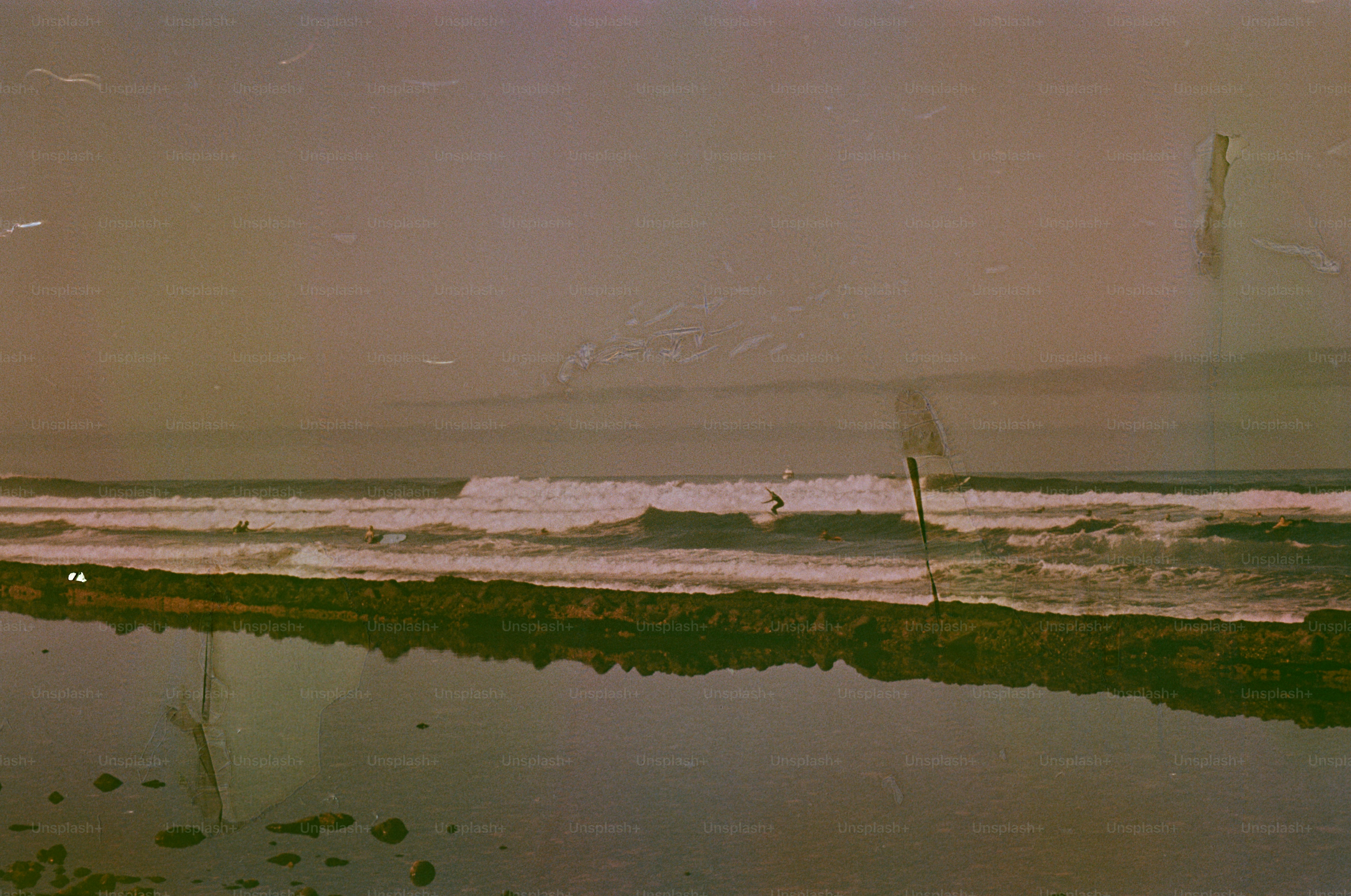 A salt flat with a body of water in foreground