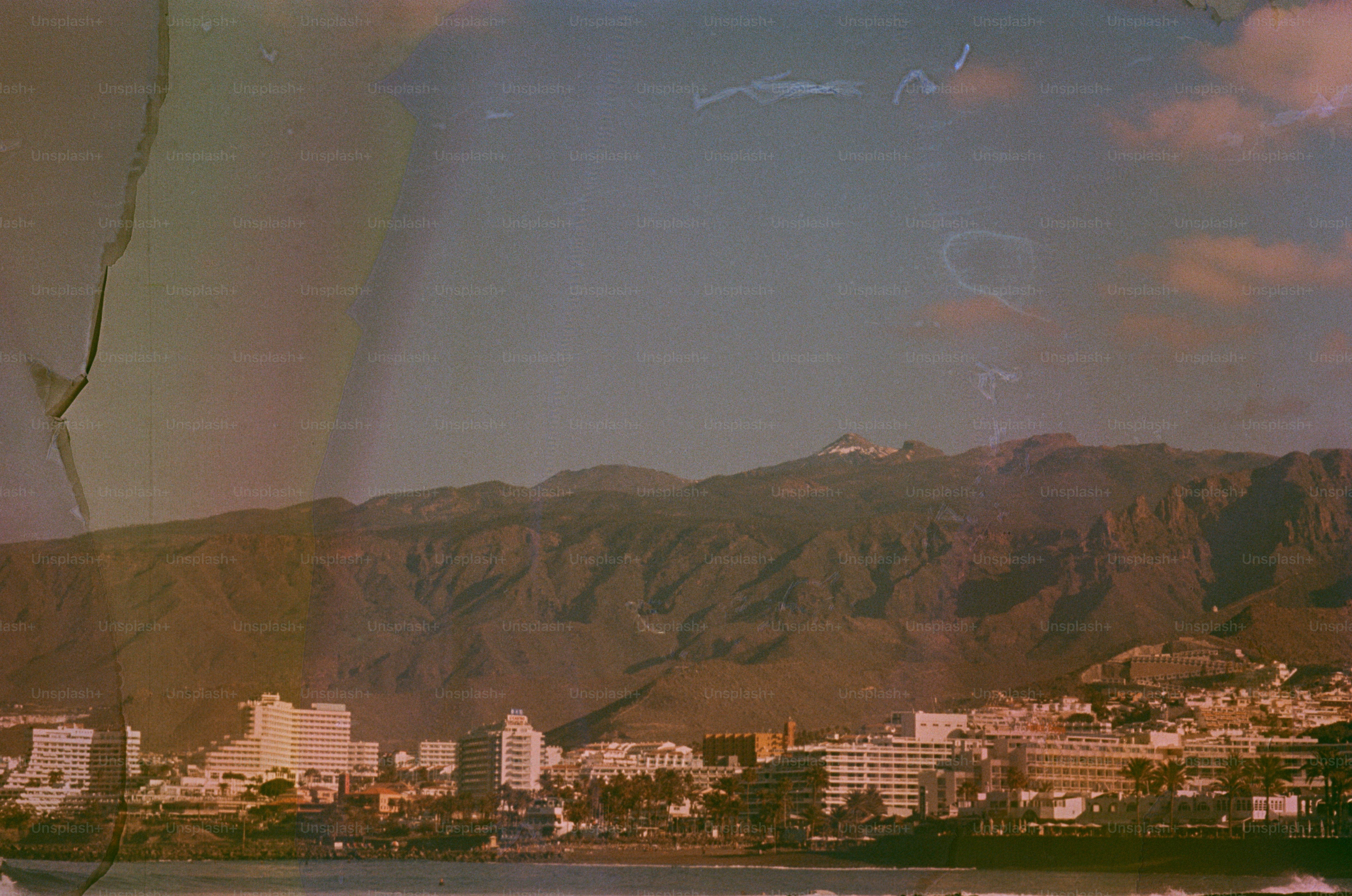 Coastal city with mountains in the background