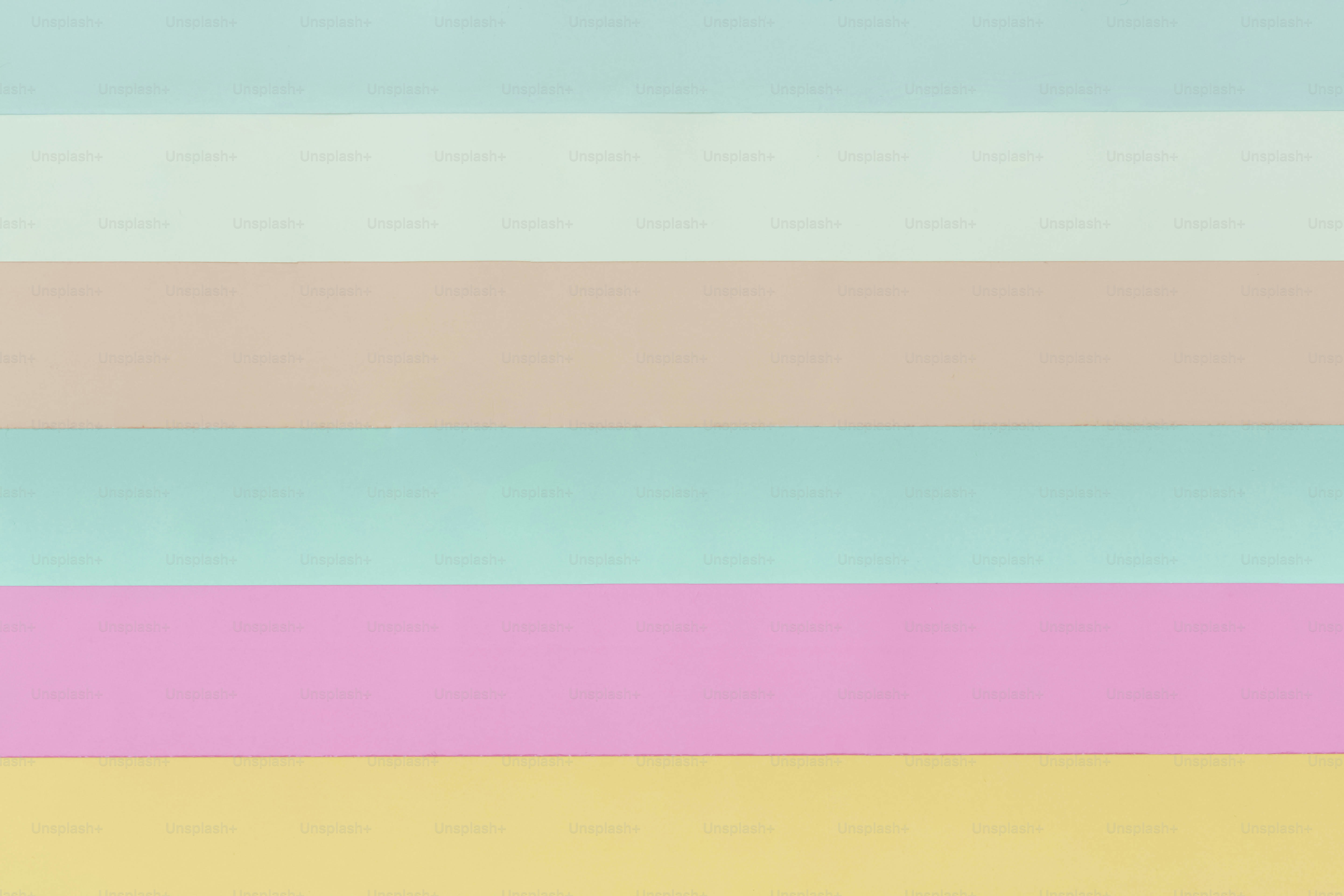 Soft pastel stripes of blue, beige, green, pink, and yellow.
