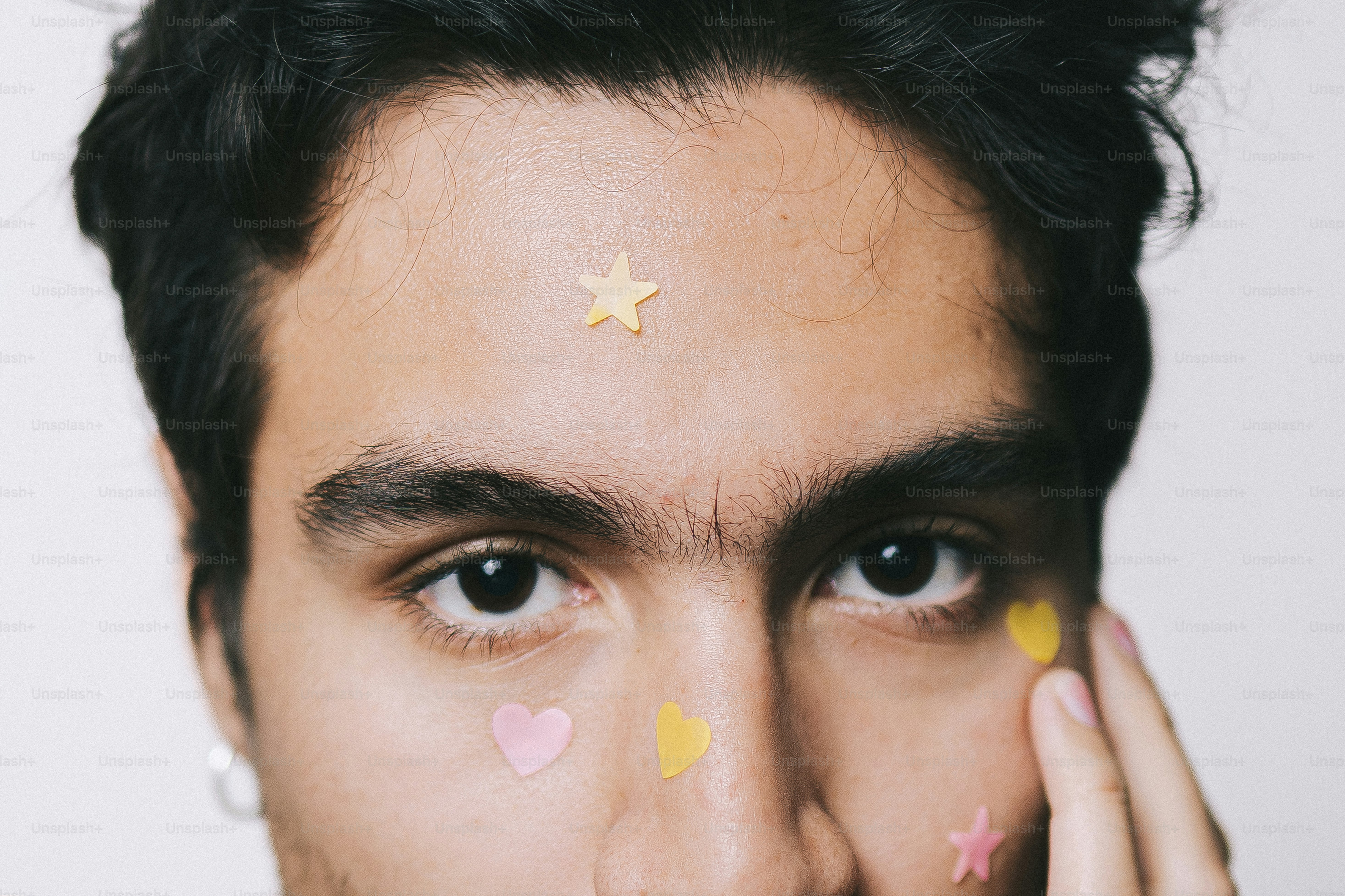 Man with stickers on his face and hands photo – Portrait Image on Unsplash