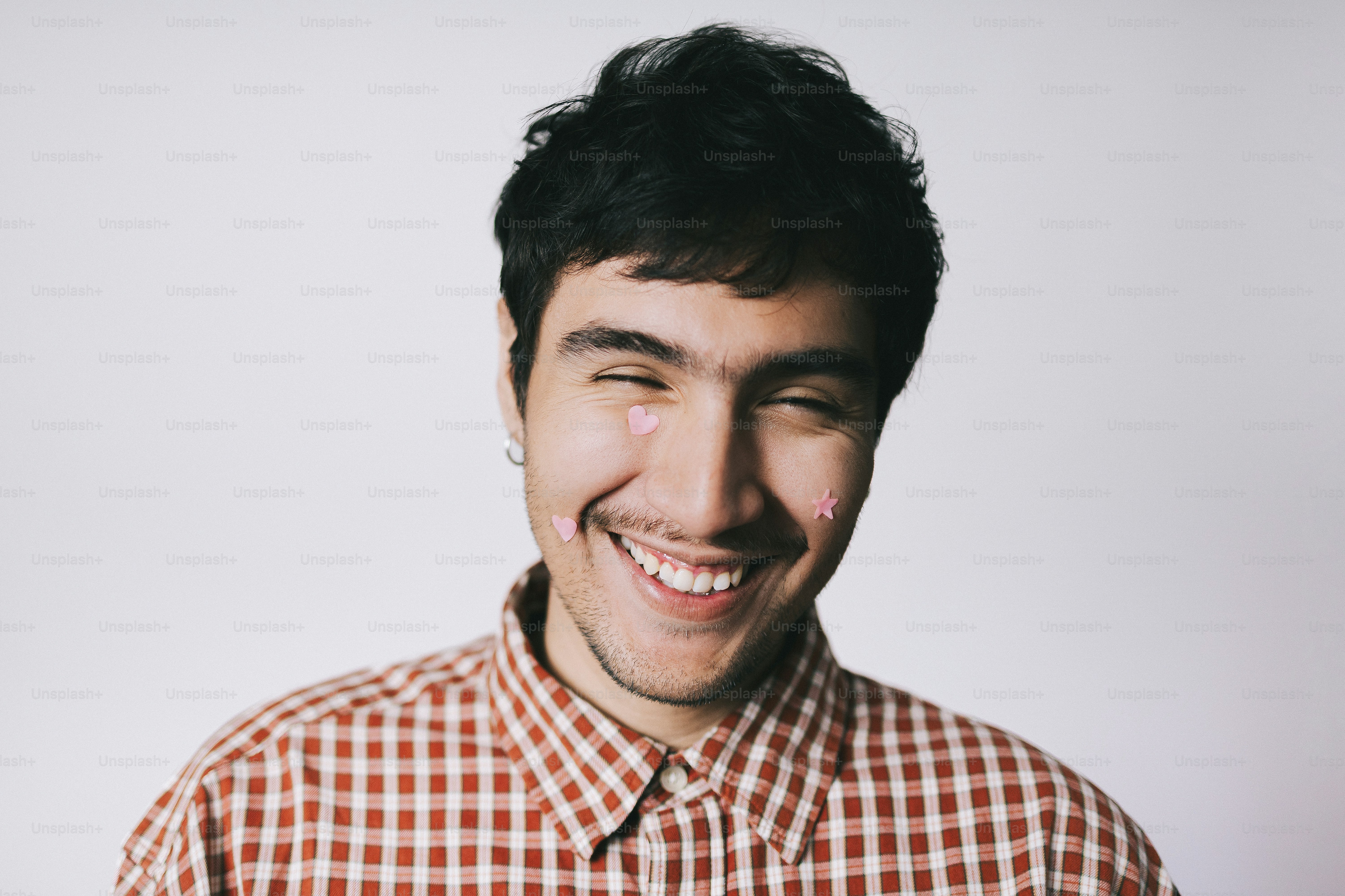 Man with stickers on his face and hands photo – Portrait Image on Unsplash