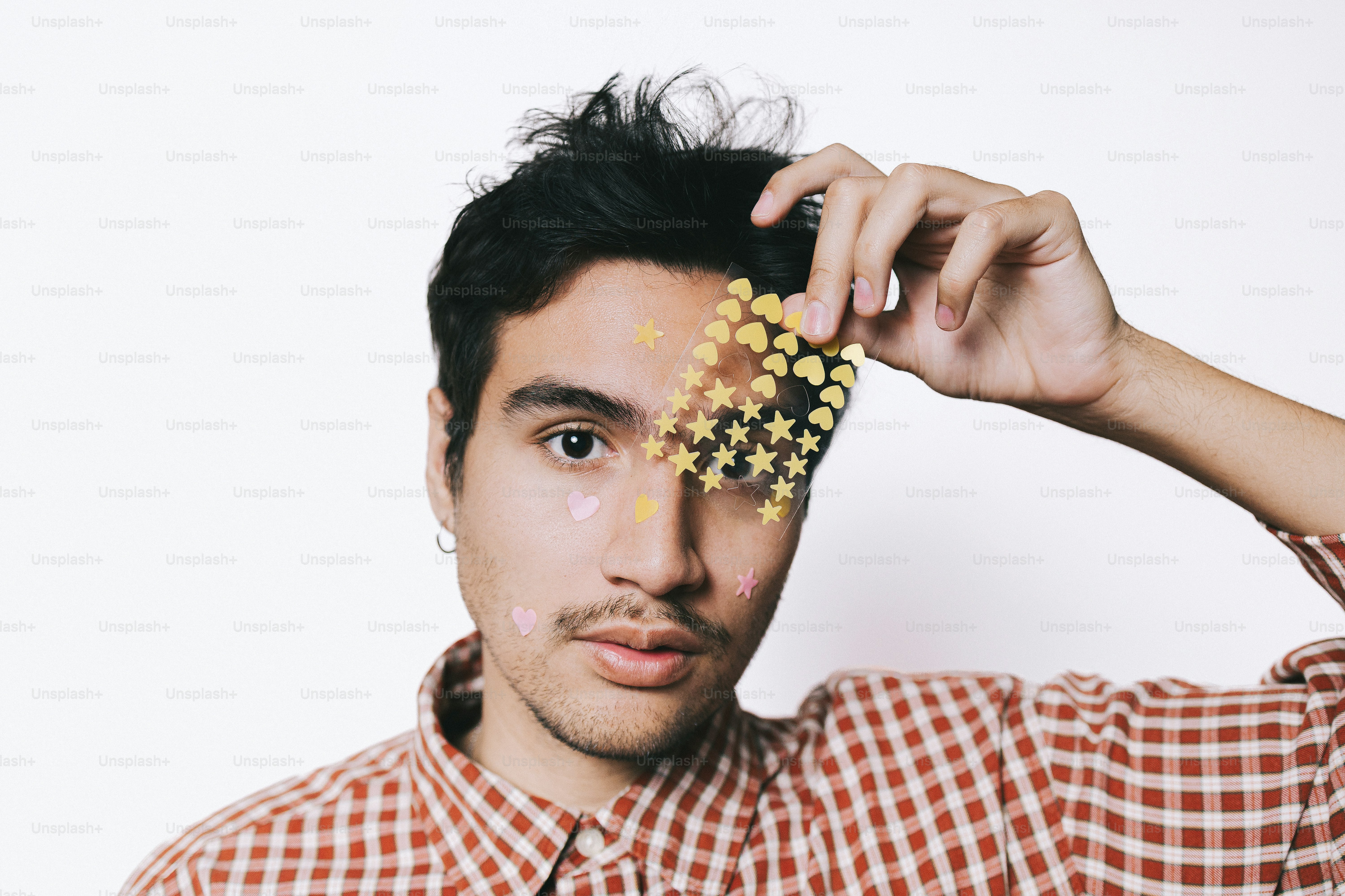 Man with stickers on his face and hands photo – Portrait Image on Unsplash