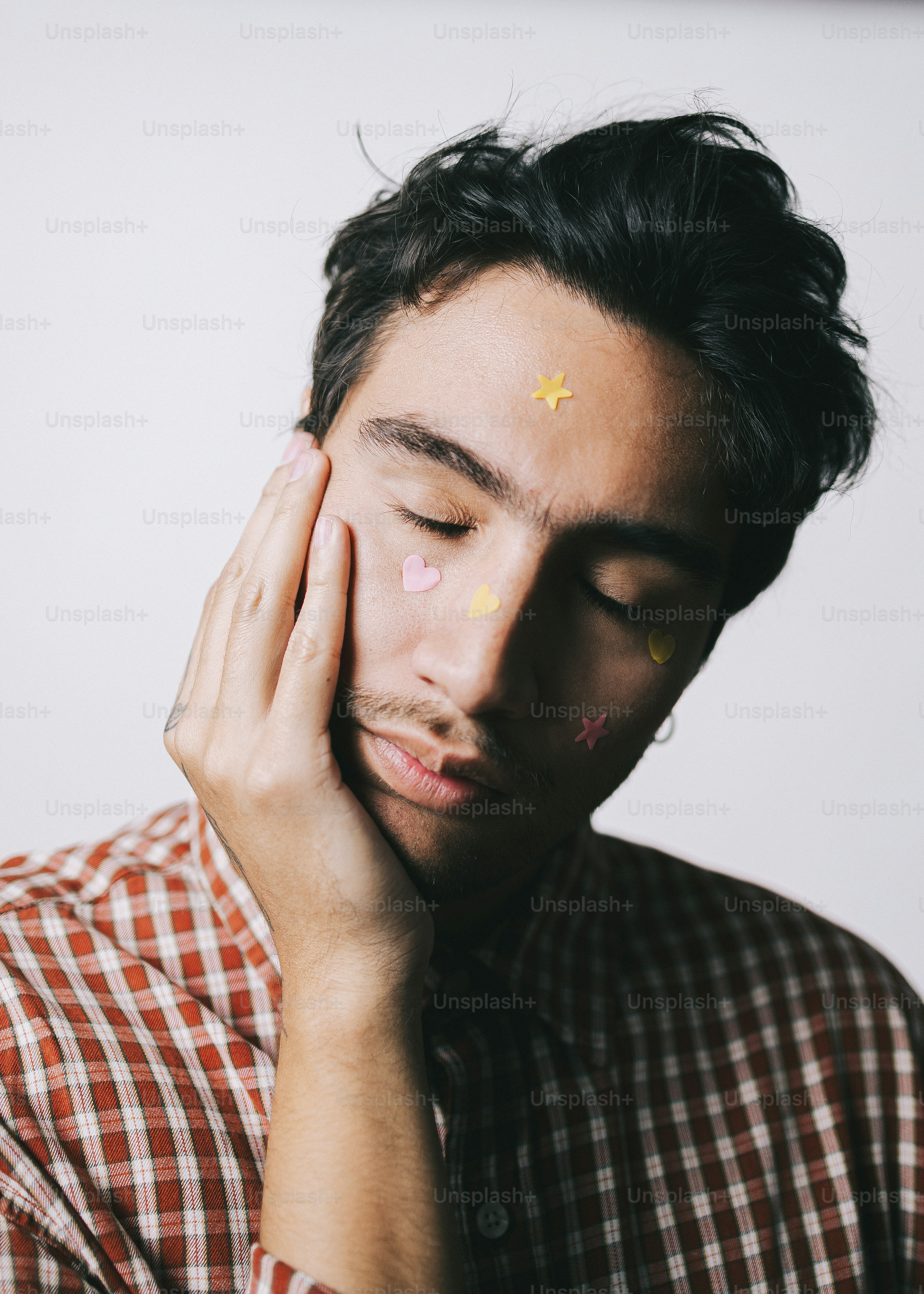 Man with stickers on his face and hands photo – Portrait Image on Unsplash